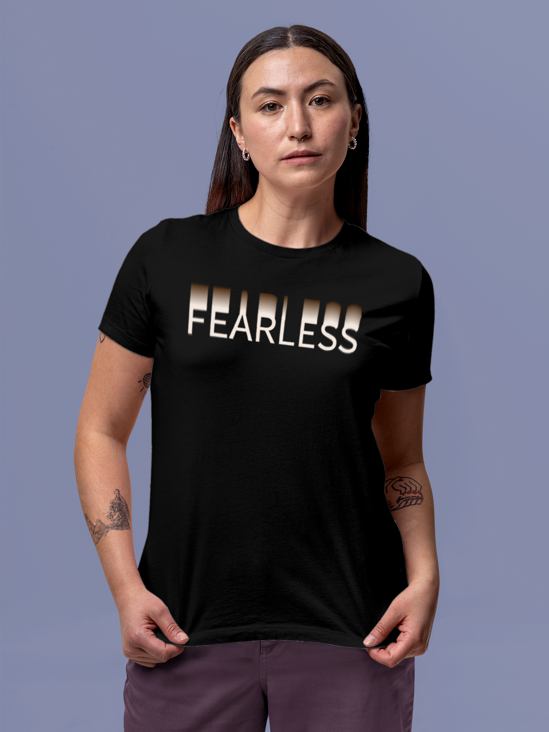 Model wearing Women's Black Round Neck T-shirt with 'Fearless' design, offering effortless style and premium comfort