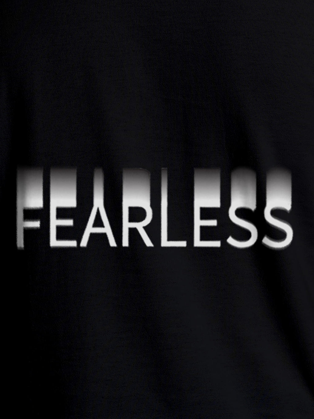 Close up of 'Fearless' design on Women's Black Round Neck T-shirt, highlighting intricate details and vibrant print.