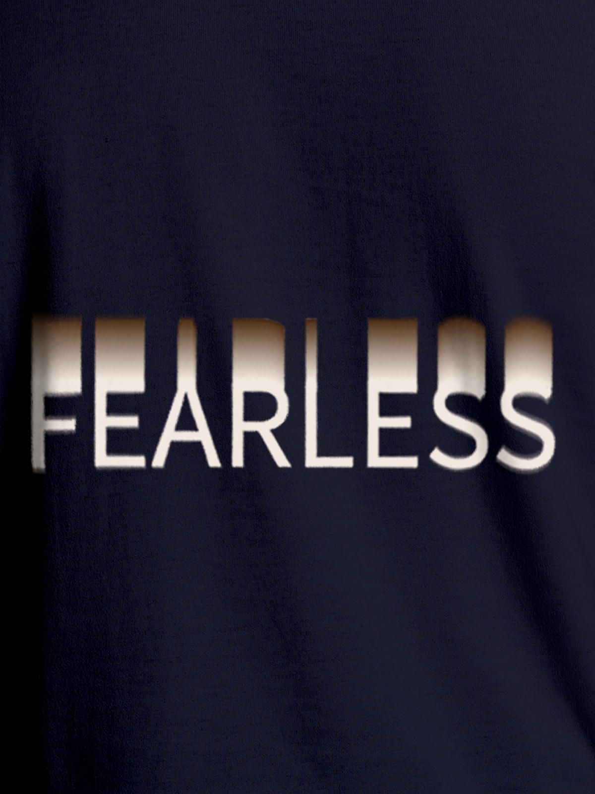 Close up of 'Fearless' design on Women's Navy Blue Round Neck T-shirt, highlighting intricate details and vibrant print.