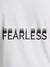 Close up of 'Fearless' design on Women's White Round Neck T-shirt, highlighting intricate details and vibrant print.