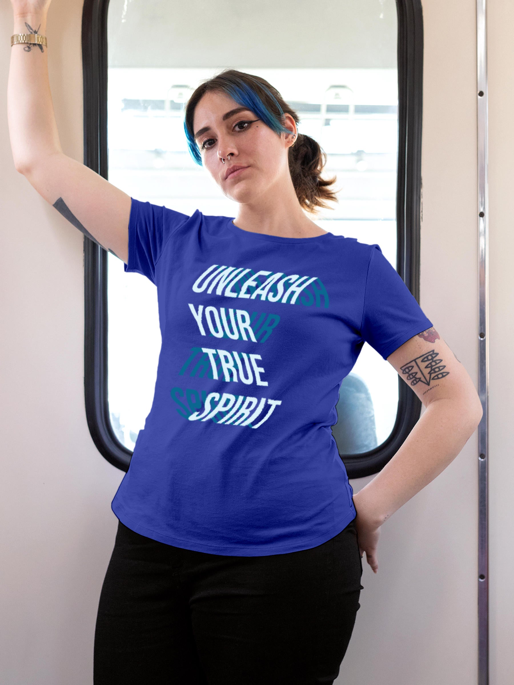 Model wearing Women's Blue Round Neck T-shirt with 'Unleash Your True Spirit' design, offering effortless style and premium comfort