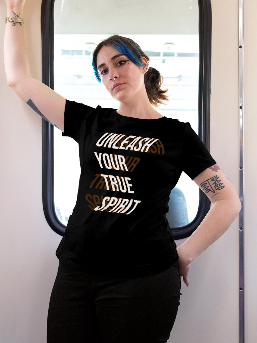 Model wearing Women's Black Round Neck T-shirt with 'Unleash Your True Spirit' design, offering effortless style and premium comfort