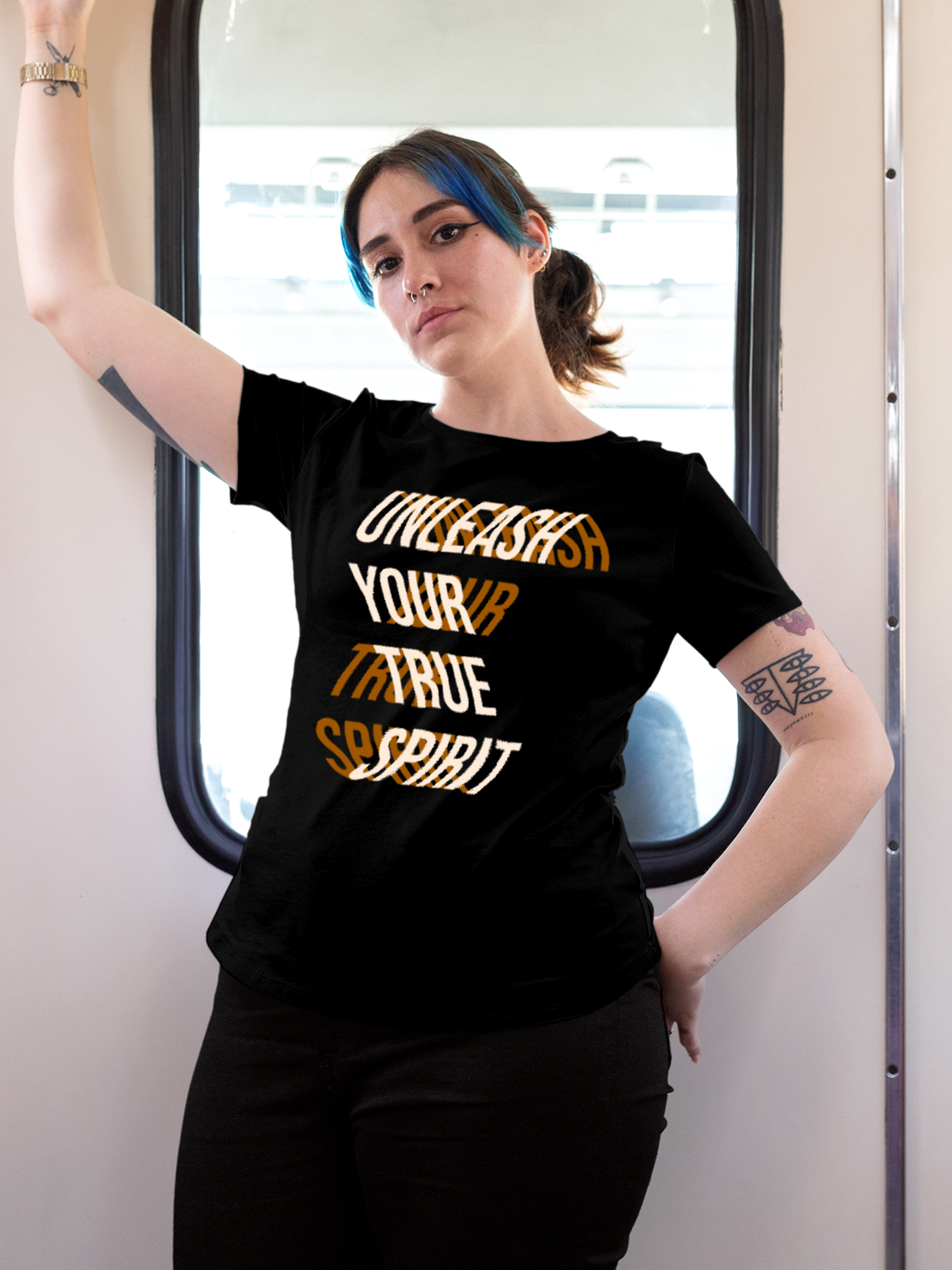 Model wearing Women's Black Round Neck T-shirt with 'Unleash Your True Spirit' design, offering effortless style and premium comfort