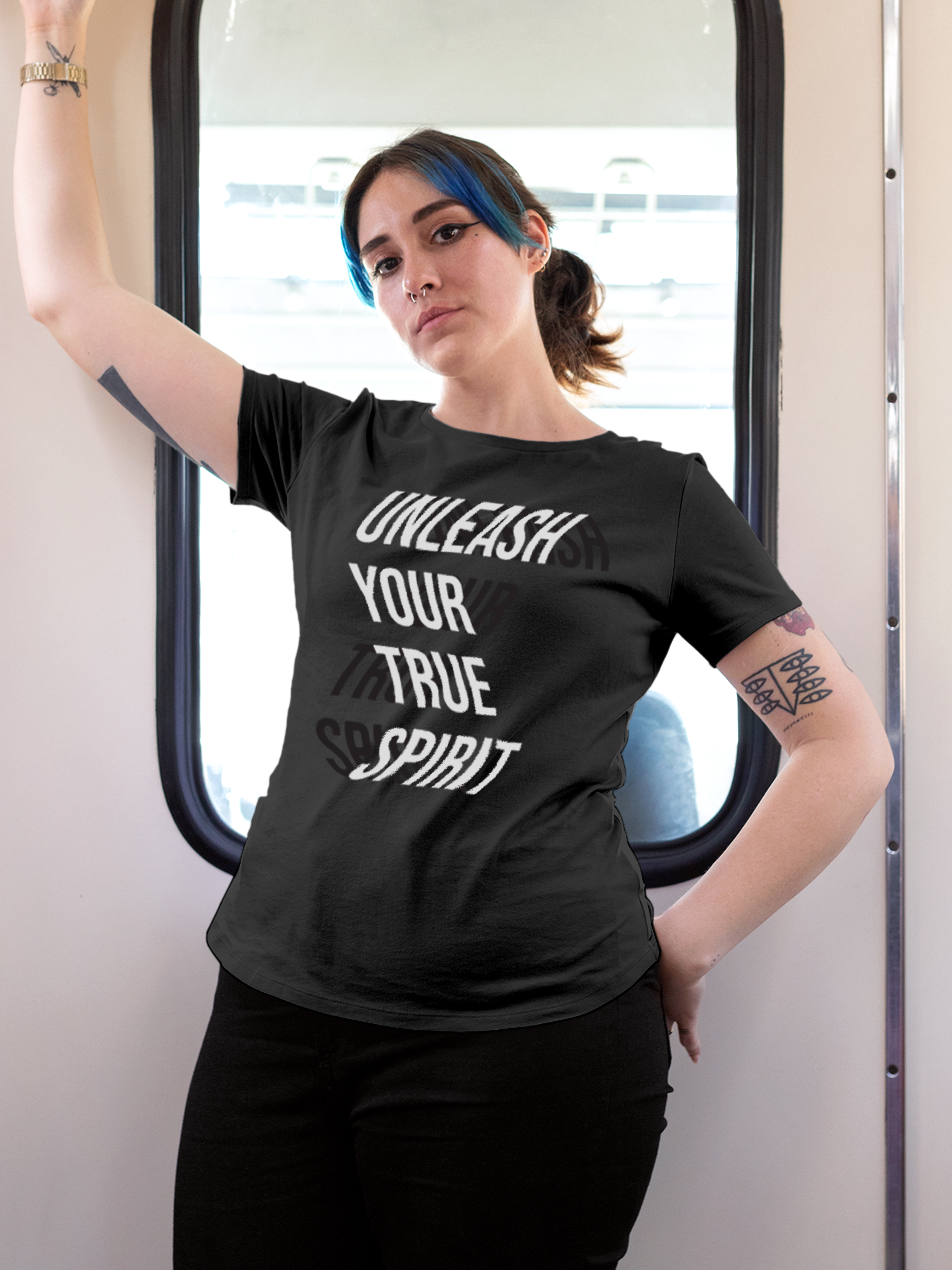 Model wearing Women's Dark Grey Round Neck T-shirt with 'Unleash Your True Spirit' design, offering effortless style and premium comfort