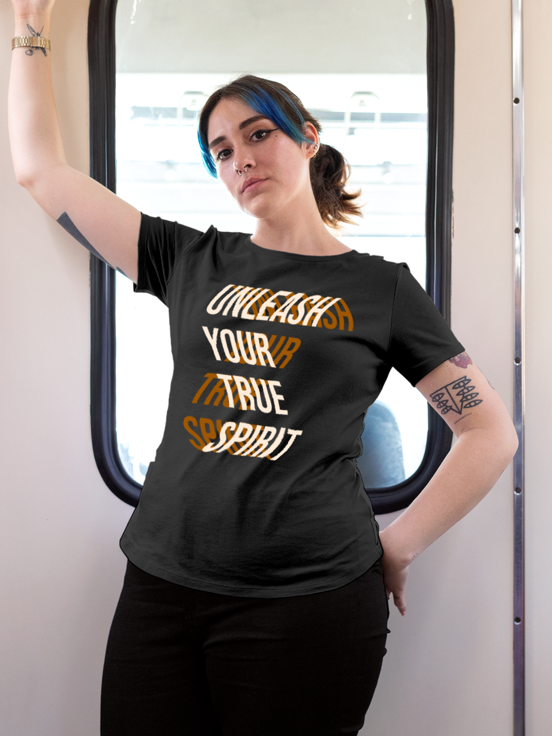 Model wearing Women's Dark Grey Round Neck T-shirt with 'Unleash Your True Spirit' design, offering effortless style and premium comfort