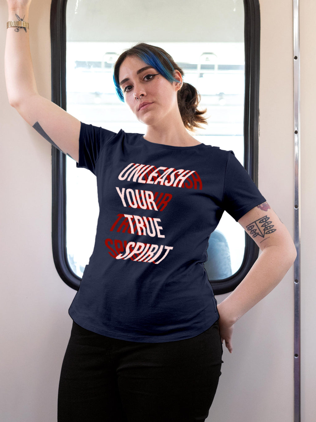 Model wearing Women's Navy Blue Round Neck T-shirt with 'Unleash Your True Spirit' design, offering effortless style and premium comfort