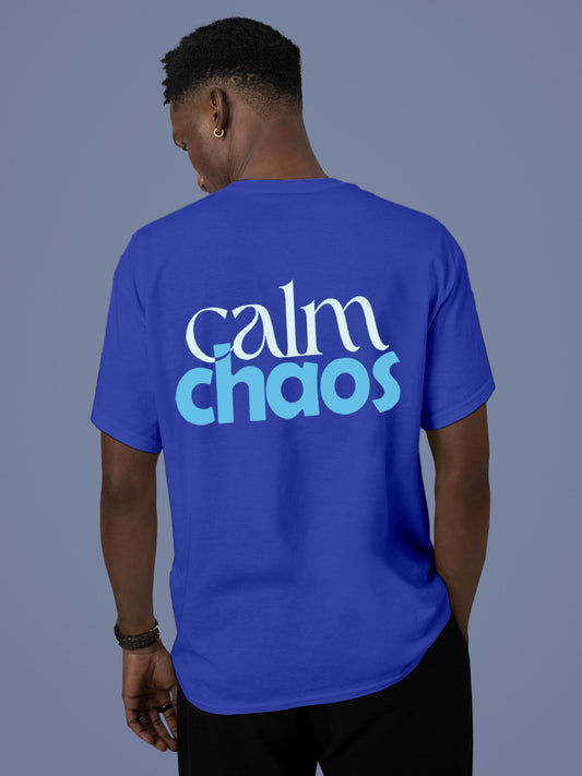 Model wearing Men's Blue Round Neck T-shirt with 'Calm Chaos' design, offering effortless style and premium comfort