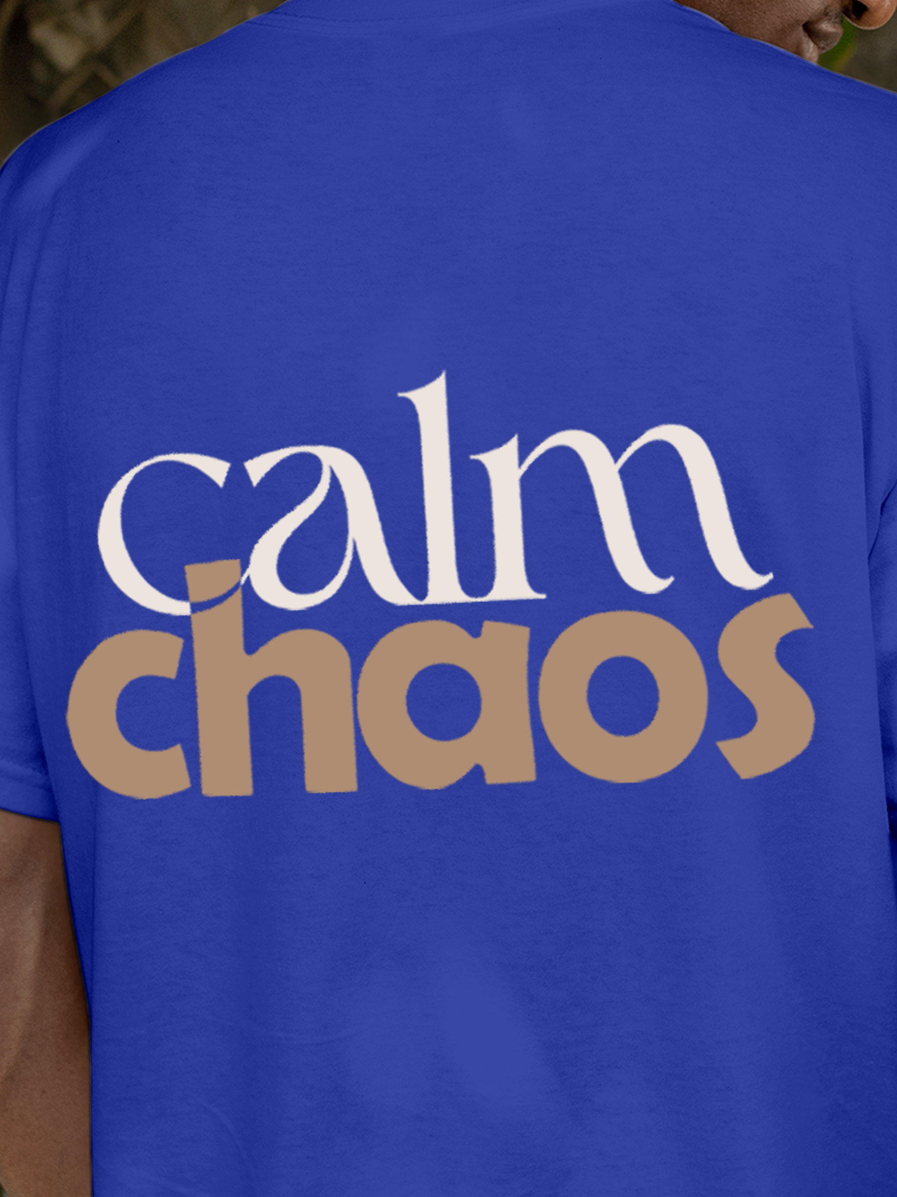 Close up of 'Calm Chaos' design on Men's Blue Round Neck T-shirt, highlighting intricate details and vibrant print.