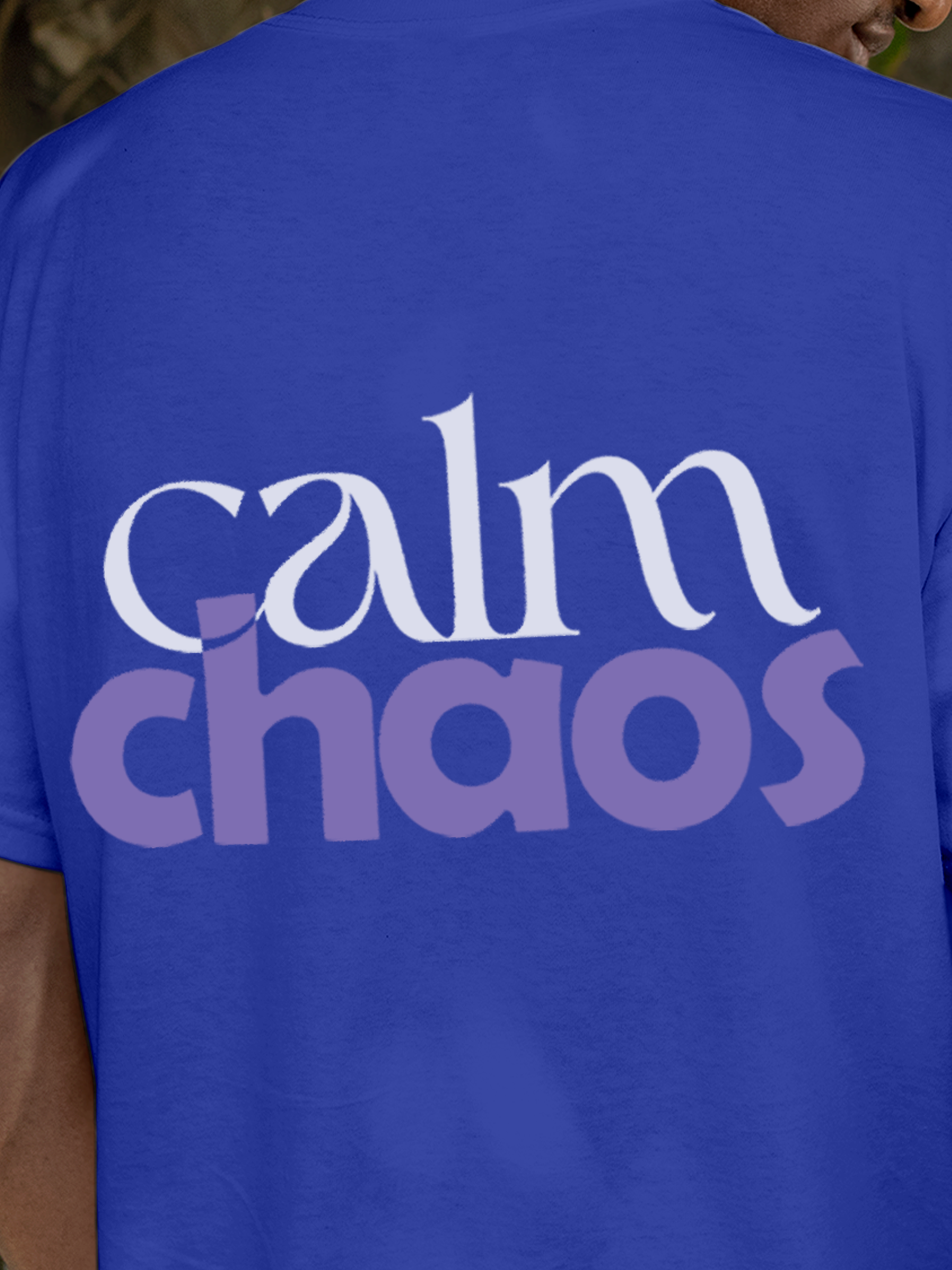 Close up of 'Calm Chaos' design on Men's Blue Round Neck T-shirt, highlighting intricate details and vibrant print.