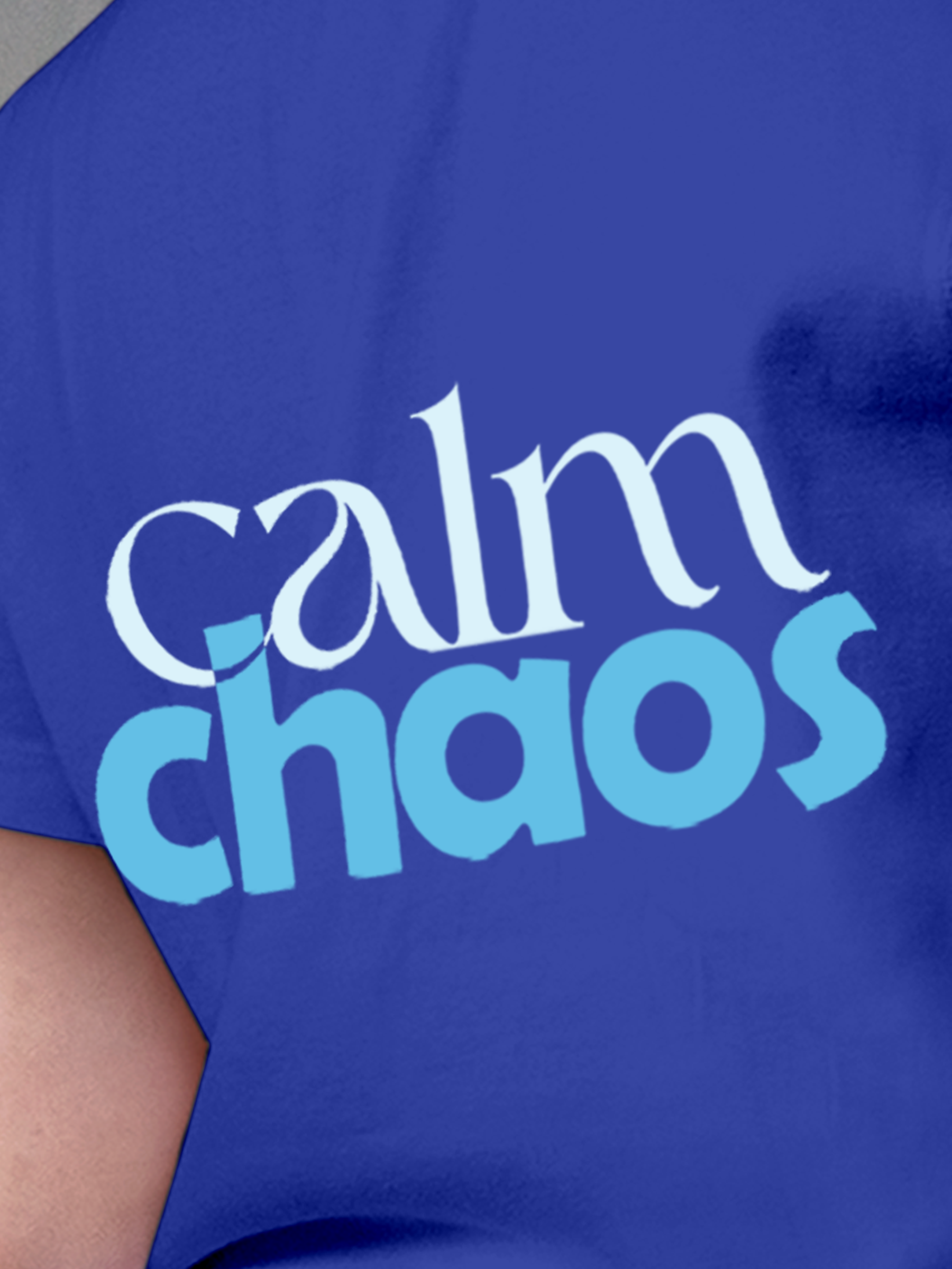 Close up of 'Calm Chaos' design on Women's Blue Round Neck T-shirt, highlighting intricate details and vibrant print.