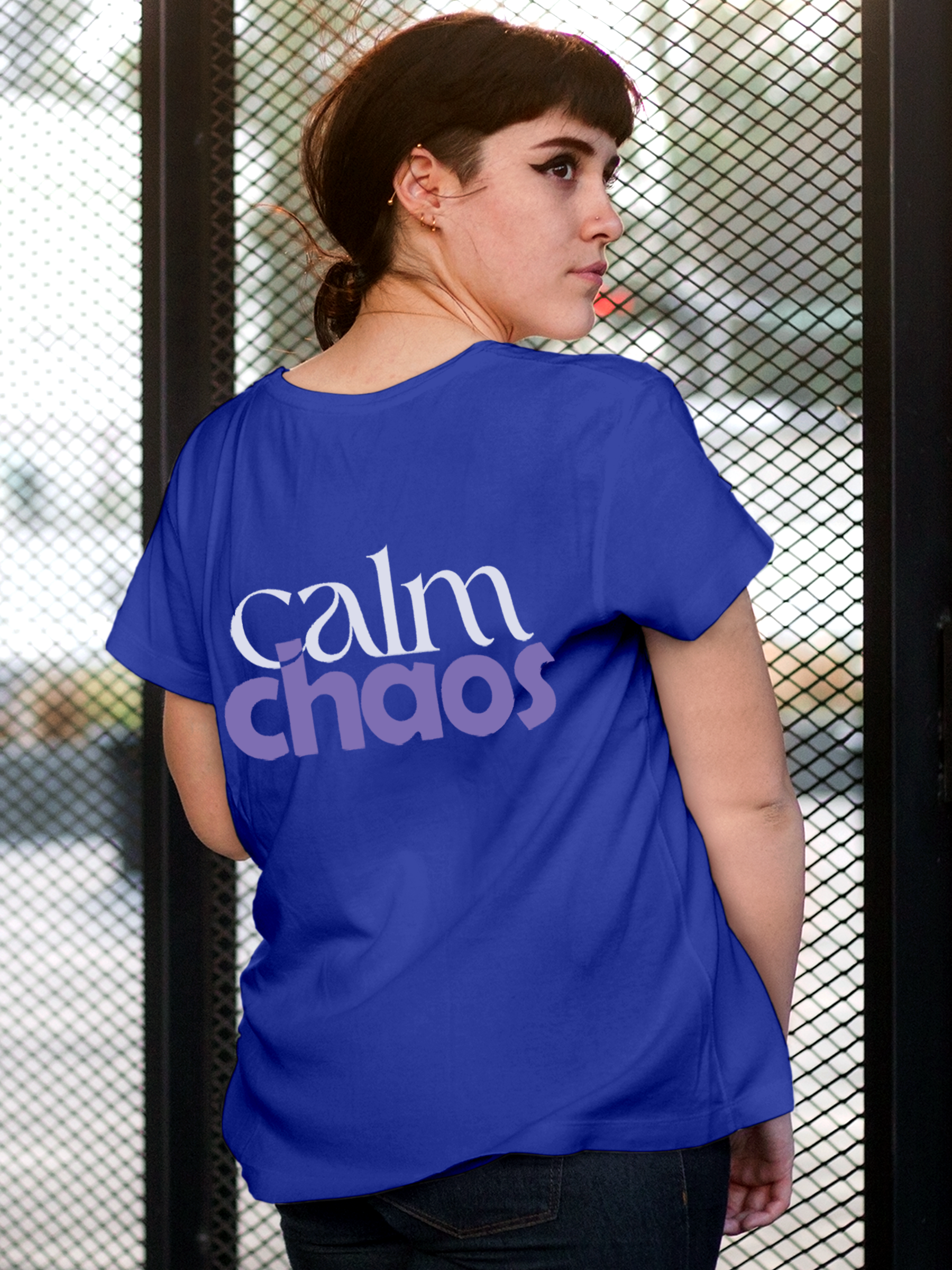 Model wearing Women's Blue Round Neck T-shirt with 'Calm Chaos' design, offering effortless style and premium comfort
