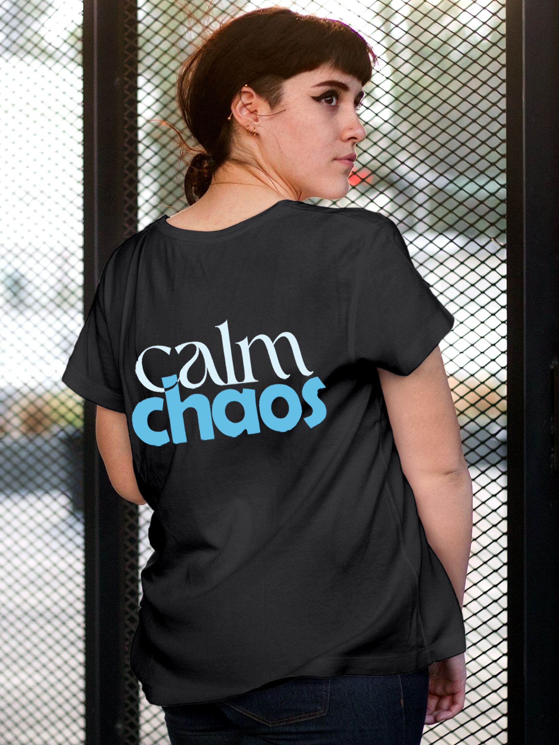 Model wearing Women's Charcoal Grey Round Neck T-shirt with 'Calm Chaos' design, offering effortless style and premium comfort