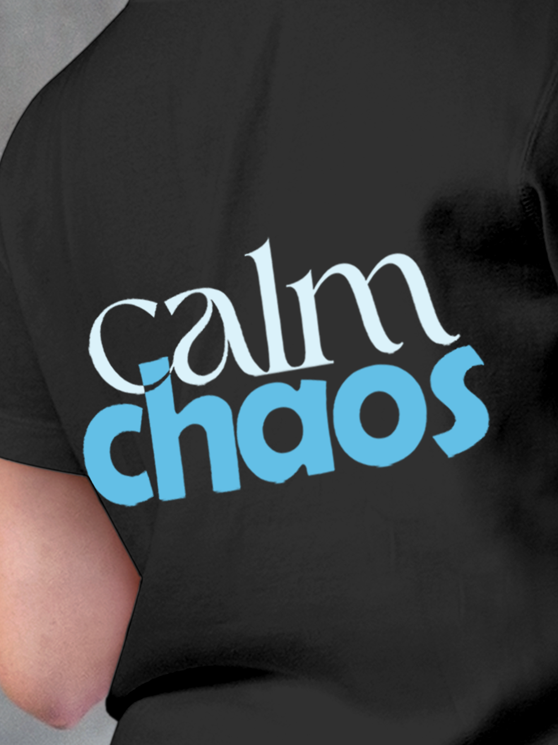 Close up of 'Calm Chaos' design on Women's Charcoal Grey Round Neck T-shirt, highlighting intricate details and vibrant print.