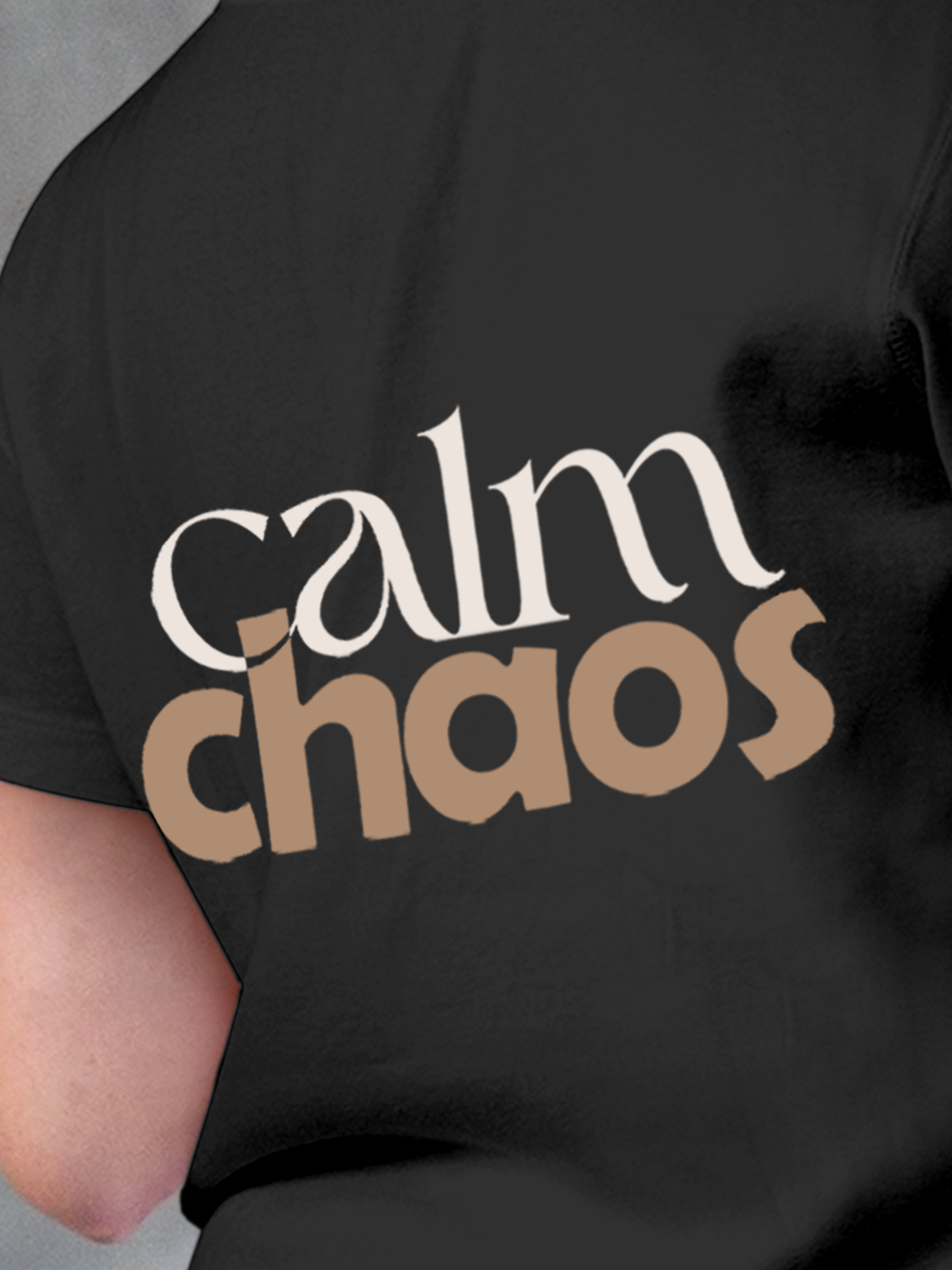 Close up of 'Calm Chaos' design on Women's Charcoal Grey Round Neck T-shirt, highlighting intricate details and vibrant print.