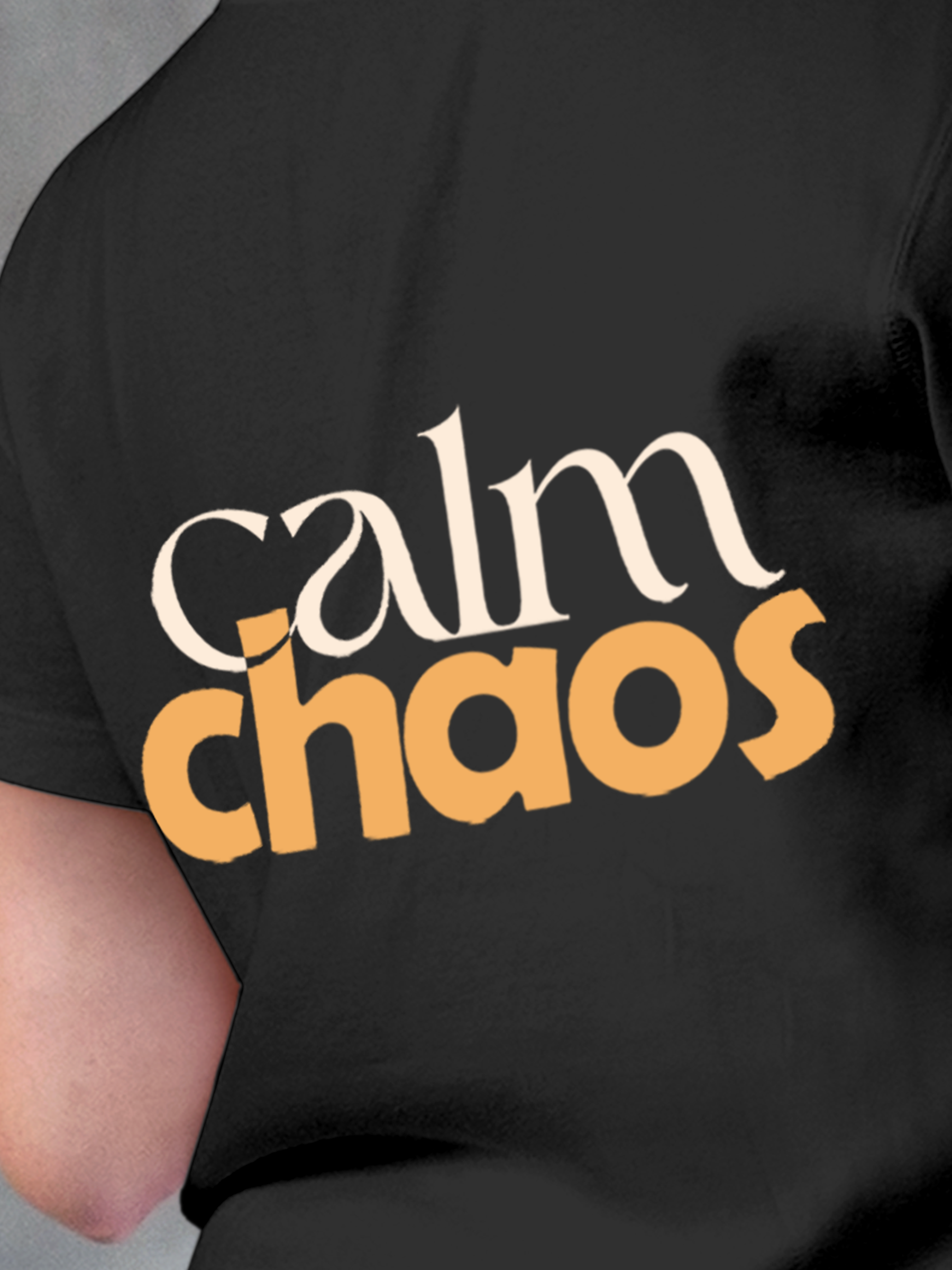 Close up of 'Calm Chaos' design on Women's Charcoal Grey Round Neck T-shirt, highlighting intricate details and vibrant print.