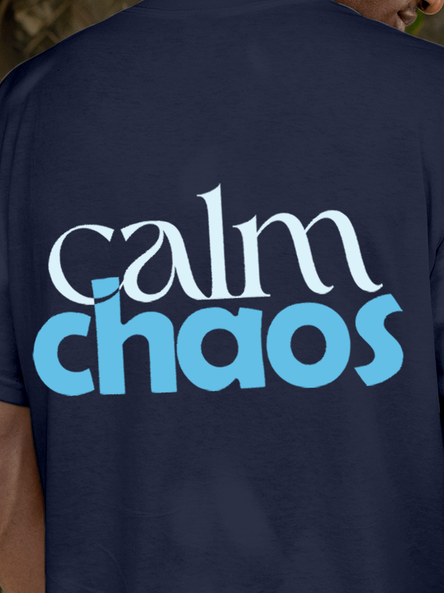 Close up of 'Calm Chaos' design on Men's Navy Blue Round Neck T-shirt, highlighting intricate details and vibrant print.