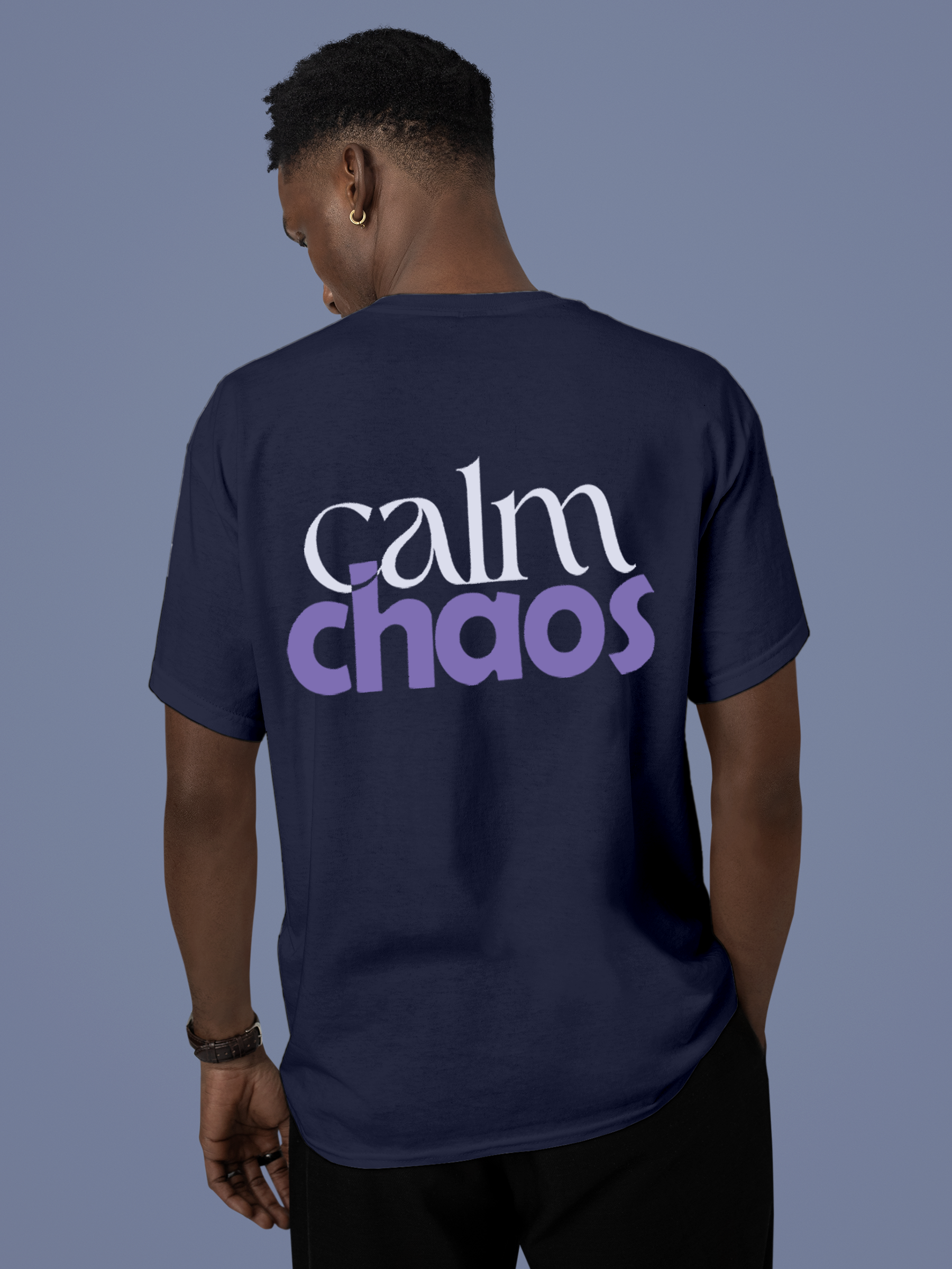 Model wearing Men's Navy Blue Round Neck T-shirt with 'Calm Chaos' design, offering effortless style and premium comfort