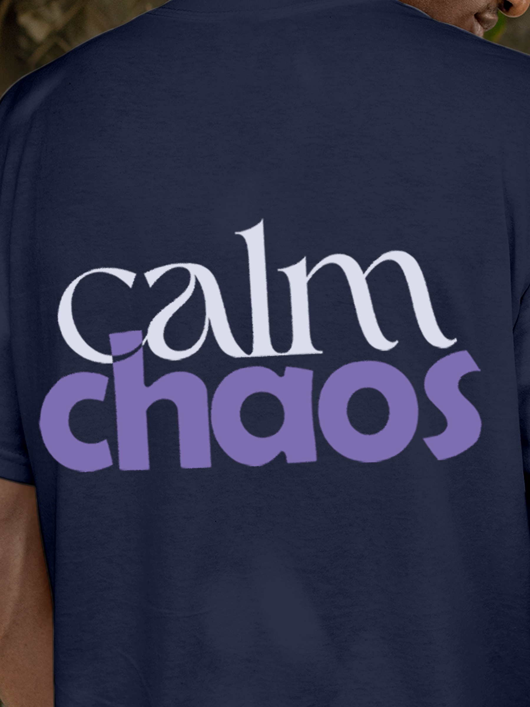 Close up of 'Calm Chaos' design on Men's Navy Blue Round Neck T-shirt, highlighting intricate details and vibrant print.