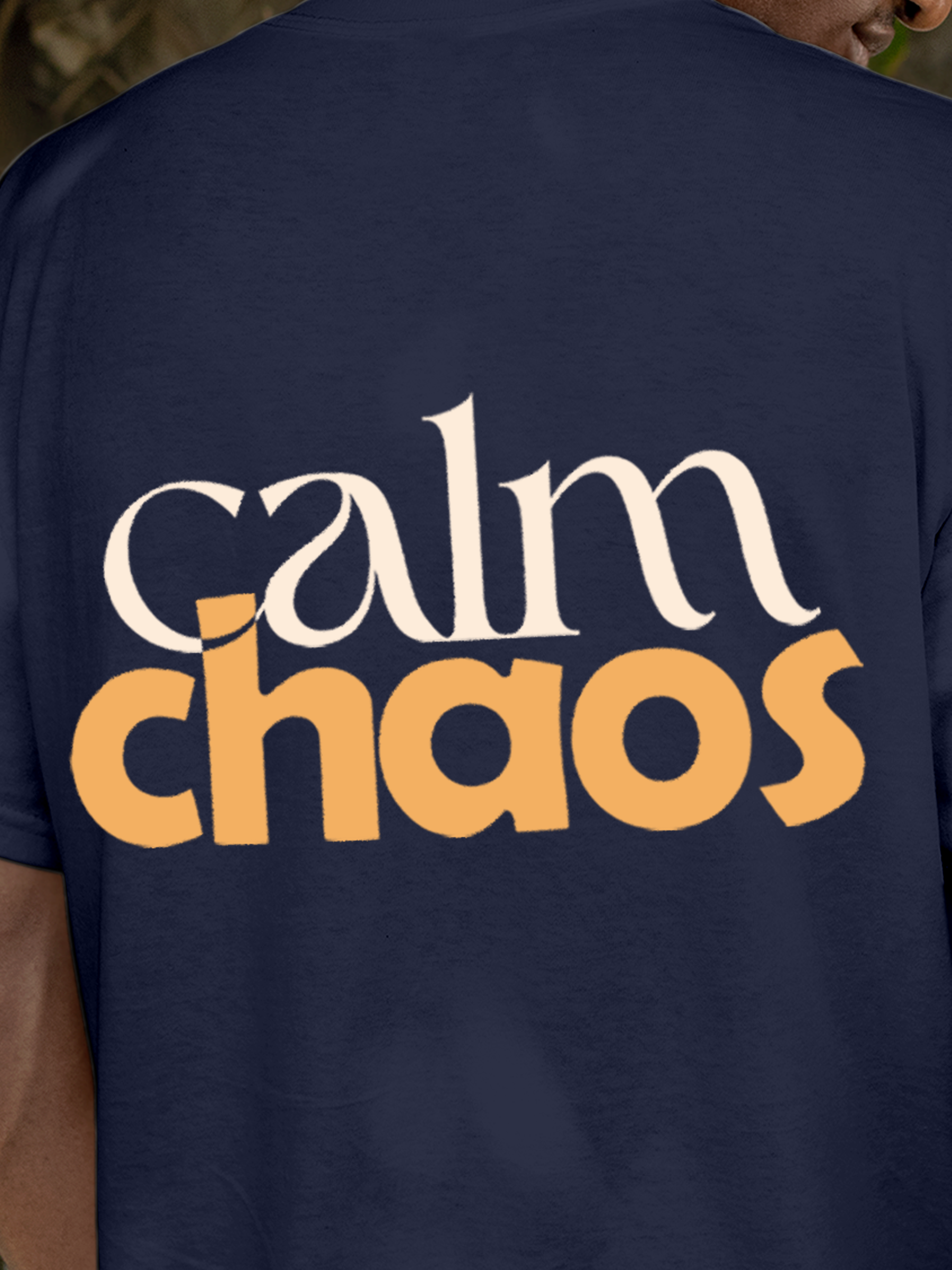 Close up of 'Calm Chaos' design on Men's Navy Blue Round Neck T-shirt, highlighting intricate details and vibrant print.