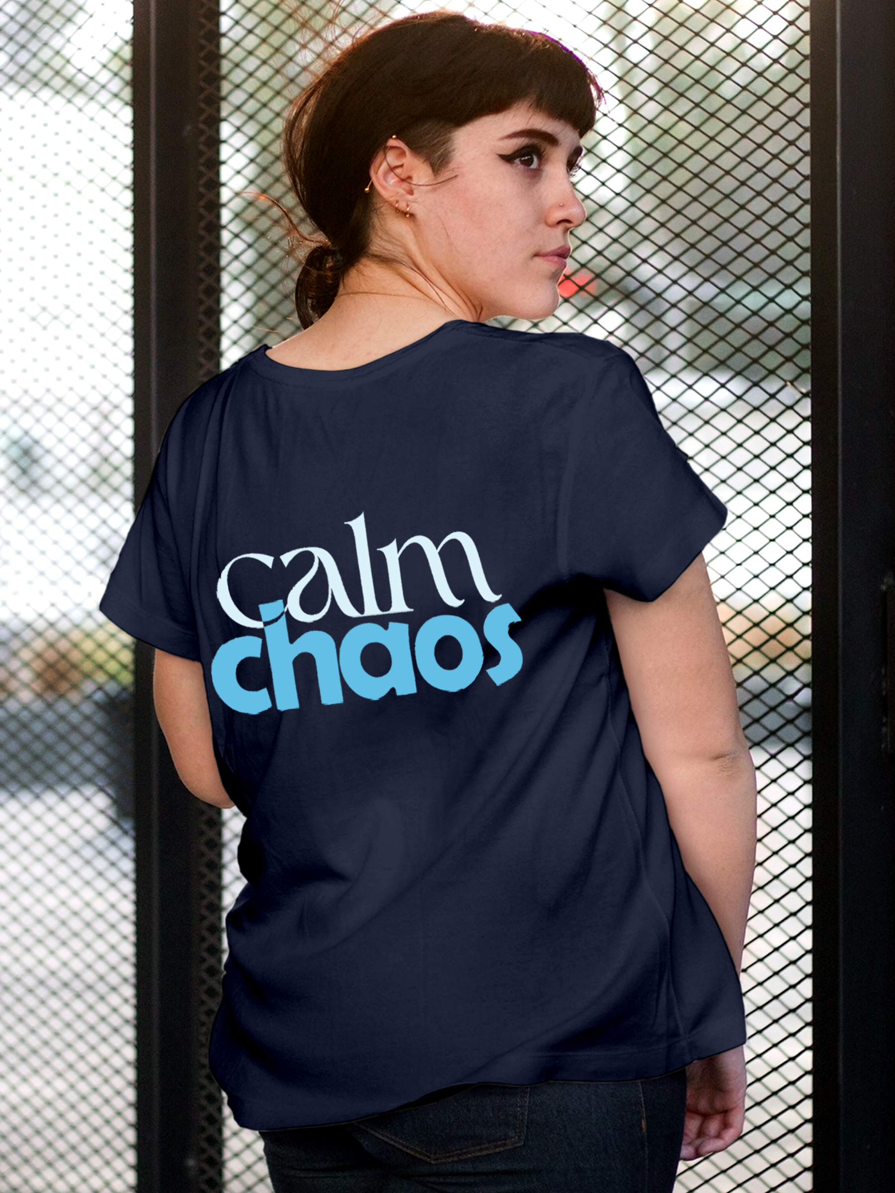 Model wearing Women's Navy Blue Round Neck T-shirt with 'Calm Chaos' design, offering effortless style and premium comfort
