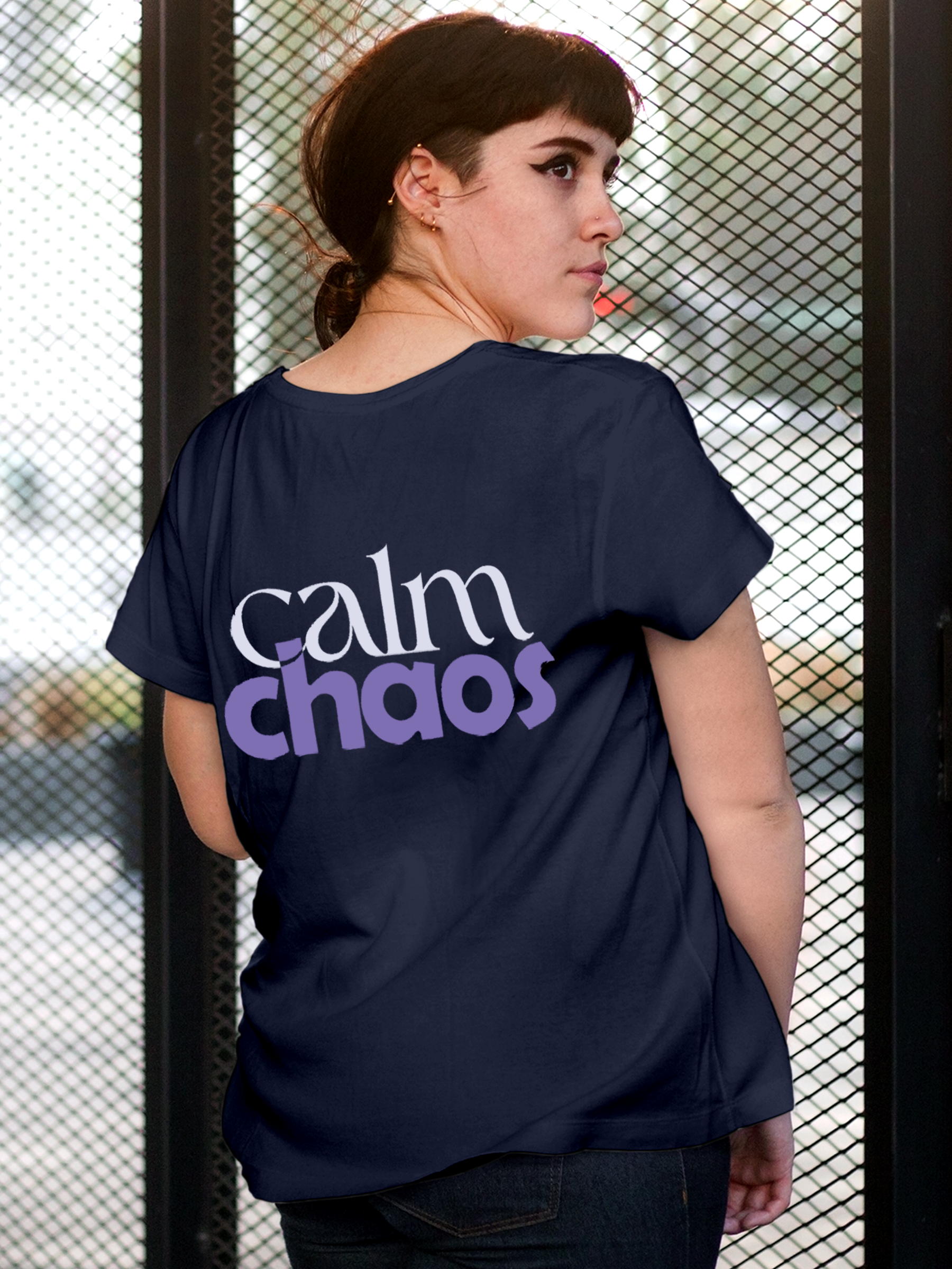 Model wearing Women's Navy Blue Round Neck T-shirt with 'Calm Chaos' design, offering effortless style and premium comfort