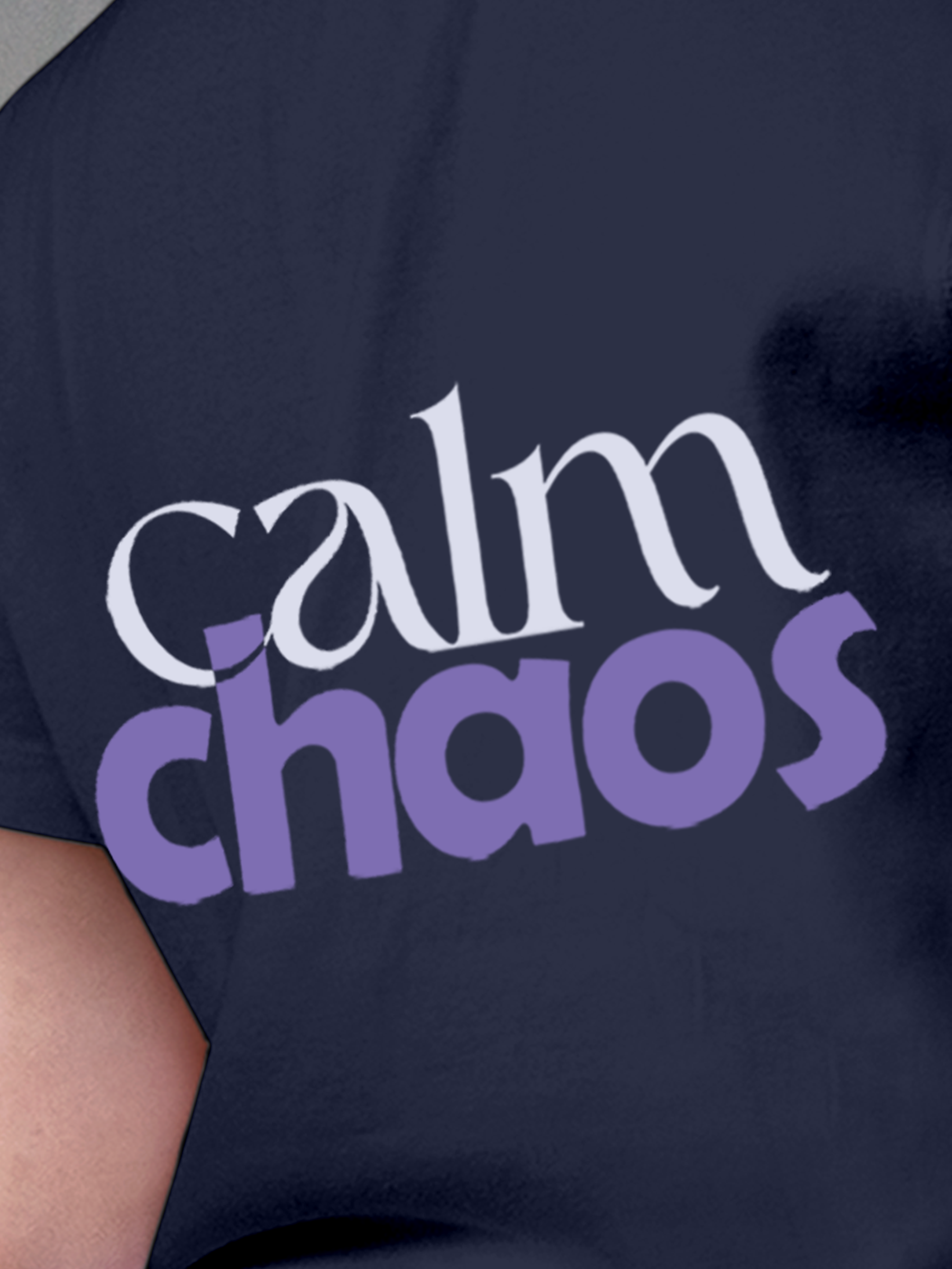 Close up of 'Calm Chaos' design on Women's Navy Blue Round Neck T-shirt, highlighting intricate details and vibrant print.