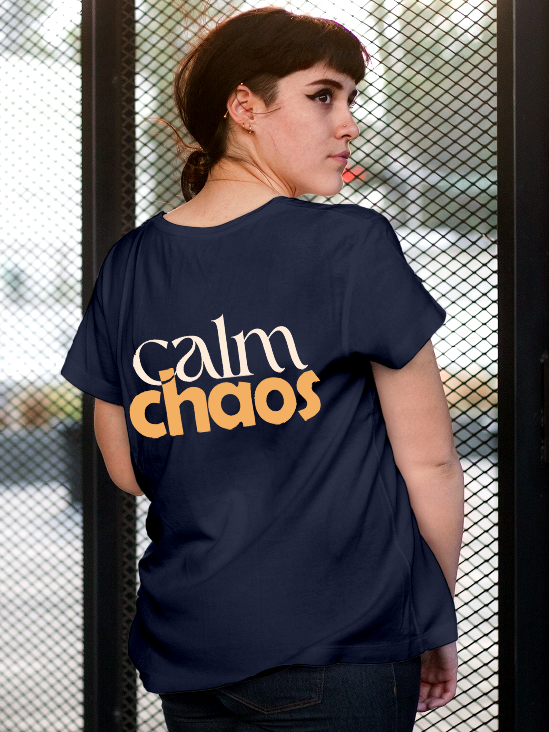 Model wearing Women's Navy Blue Round Neck T-shirt with 'Calm Chaos' design, offering effortless style and premium comfort