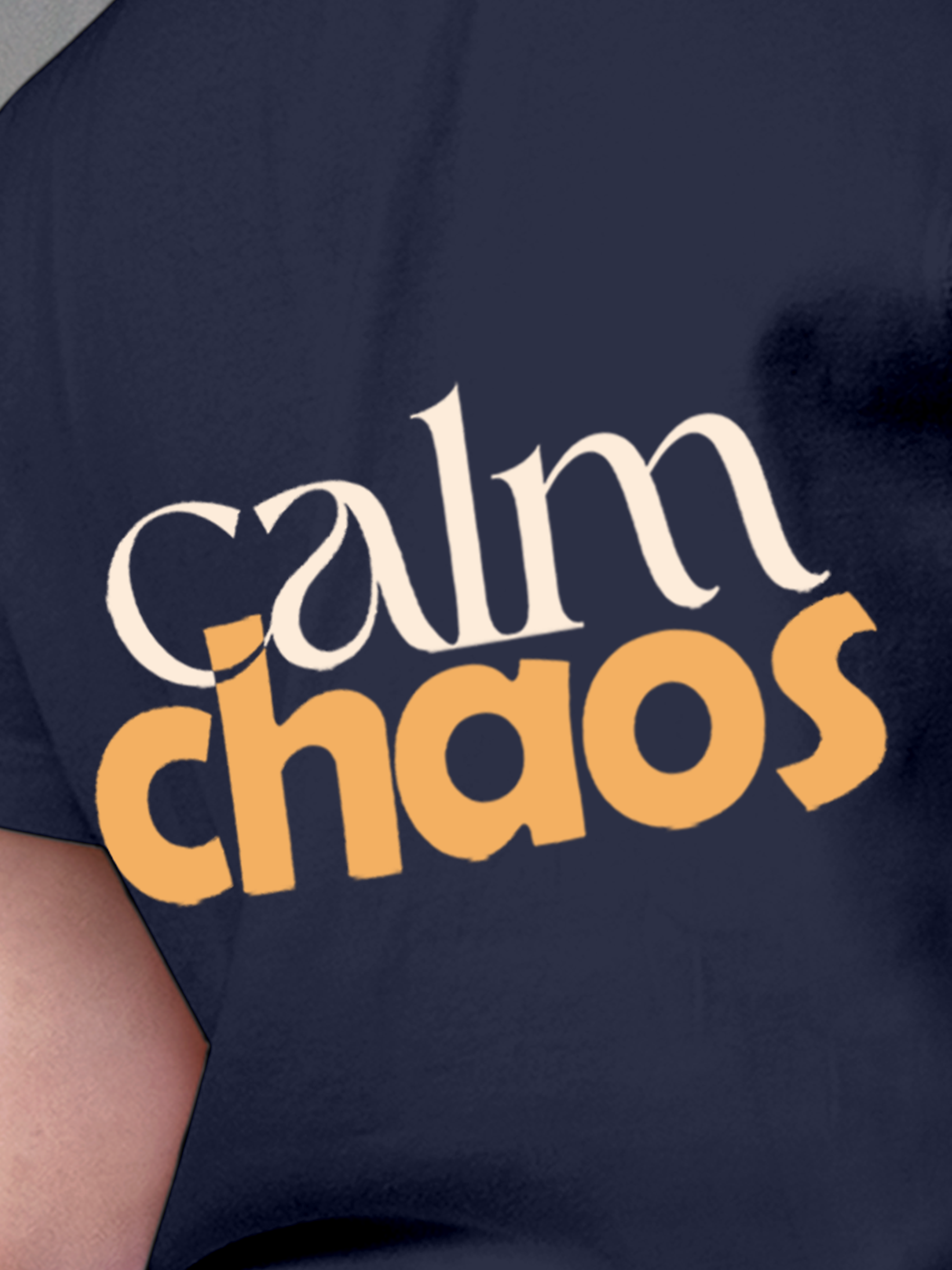 Close up of 'Calm Chaos' design on Women's Navy Blue Round Neck T-shirt, highlighting intricate details and vibrant print.