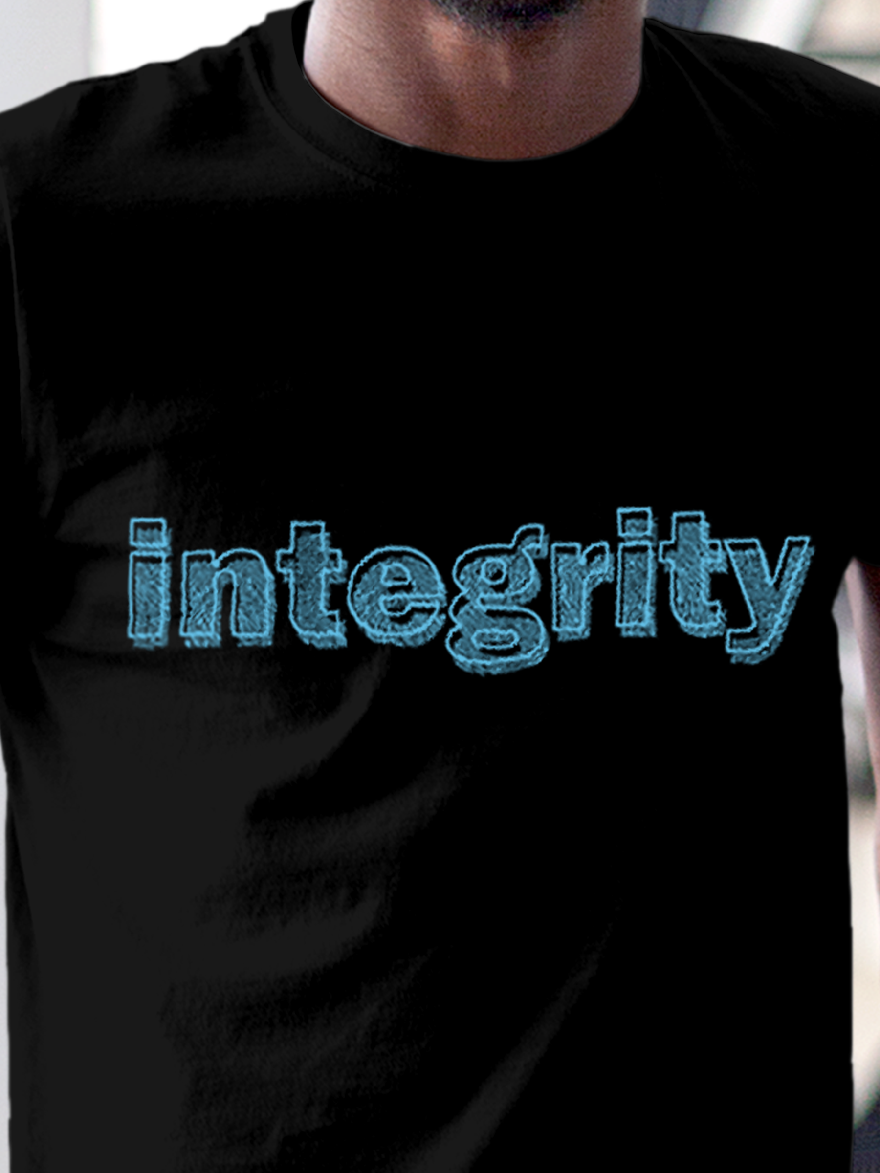 Close up of 'Integrity' design on Men's Black Round Neck T-shirt, highlighting intricate details and vibrant print.