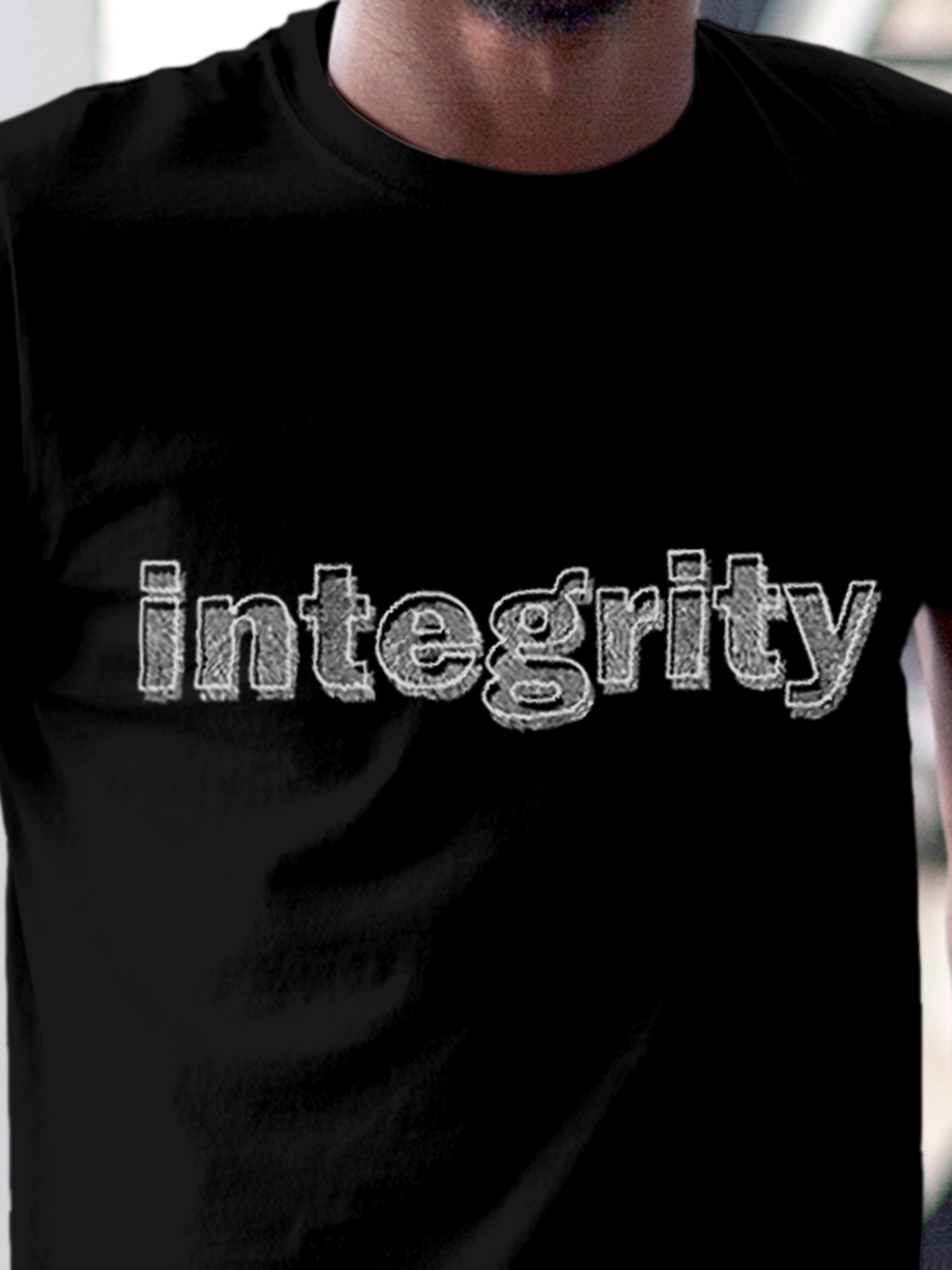 Close up of 'Integrity' design on Men's Black Round Neck T-shirt, highlighting intricate details and vibrant print.