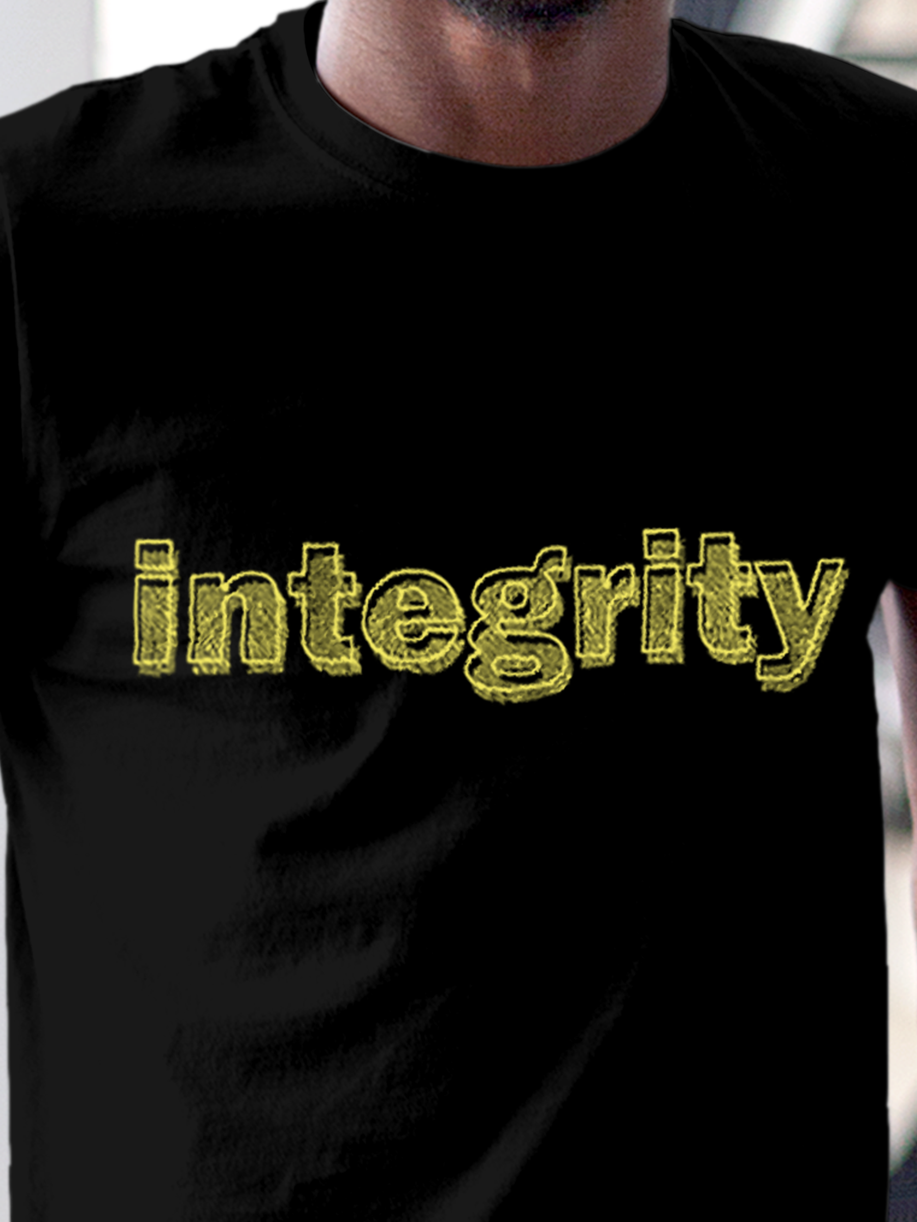 Close up of 'Integrity' design on Men's Black Round Neck T-shirt, highlighting intricate details and vibrant print.