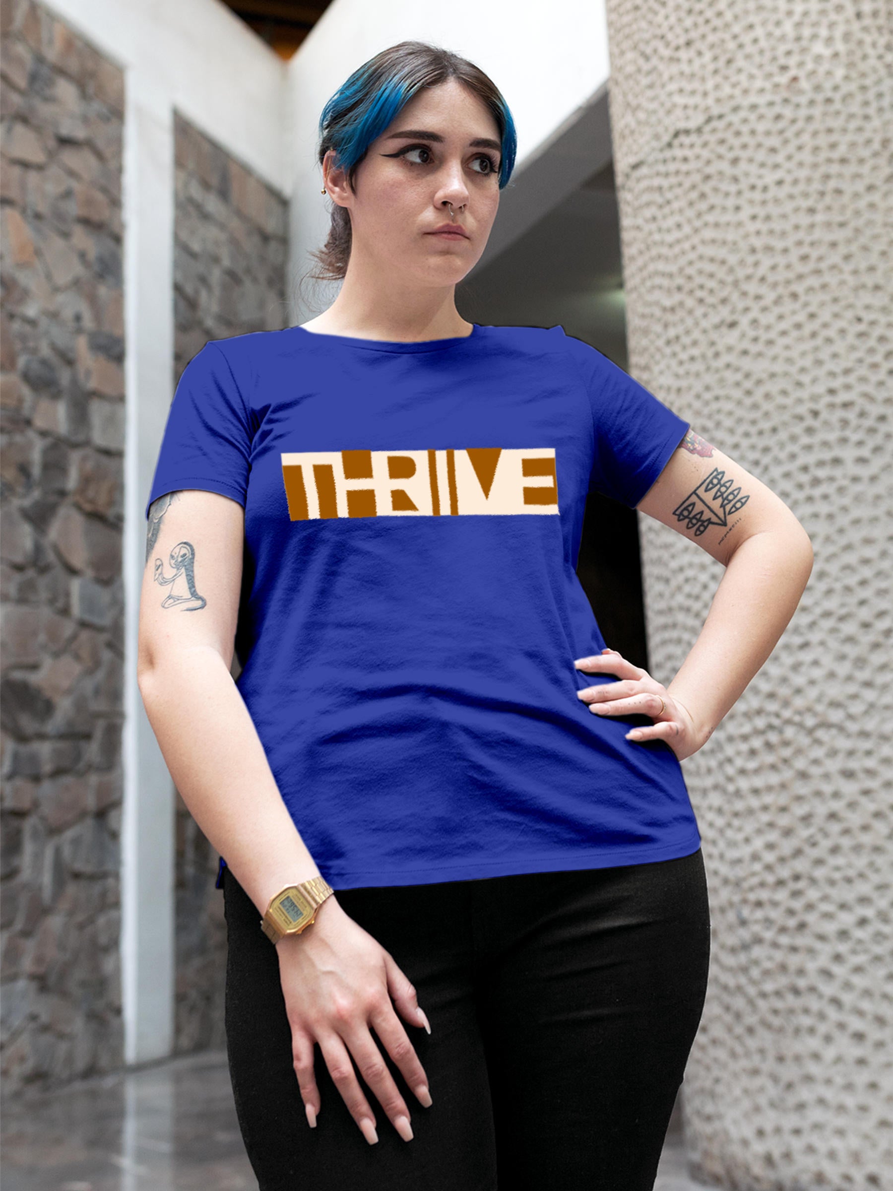 Model wearing Women's Blue Round Neck T-shirt with 'Thrive' design, offering effortless style and premium comfort
