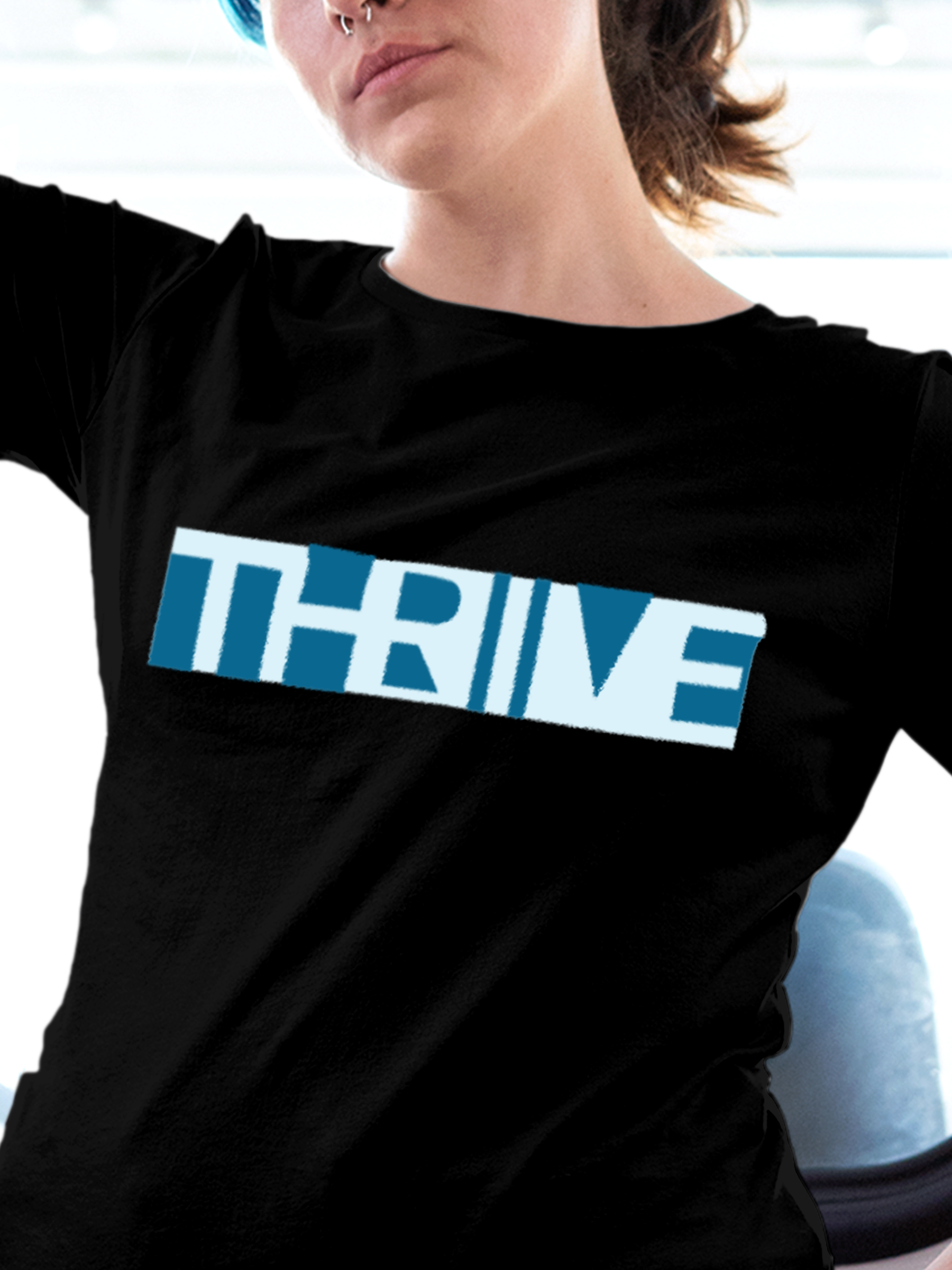Close up of 'Thrive' design on Women's Black Round Neck T-shirt, highlighting intricate details and vibrant print.