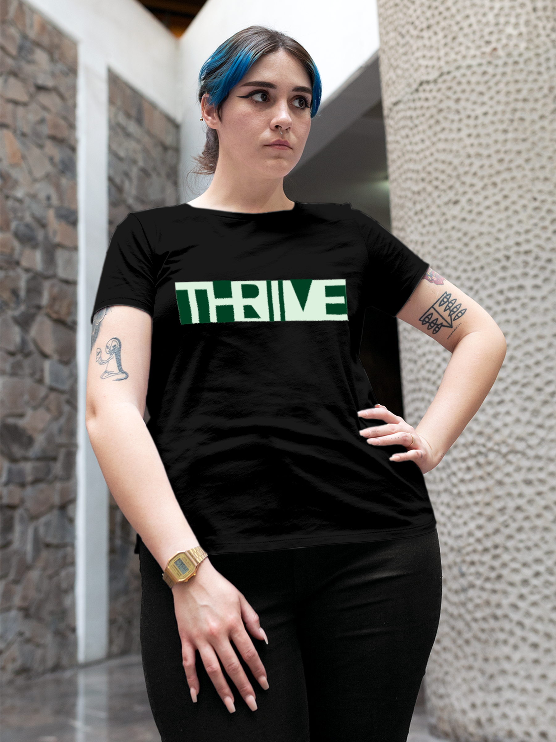 Model wearing Women's Black Round Neck T-shirt with 'Thrive' design, offering effortless style and premium comfort