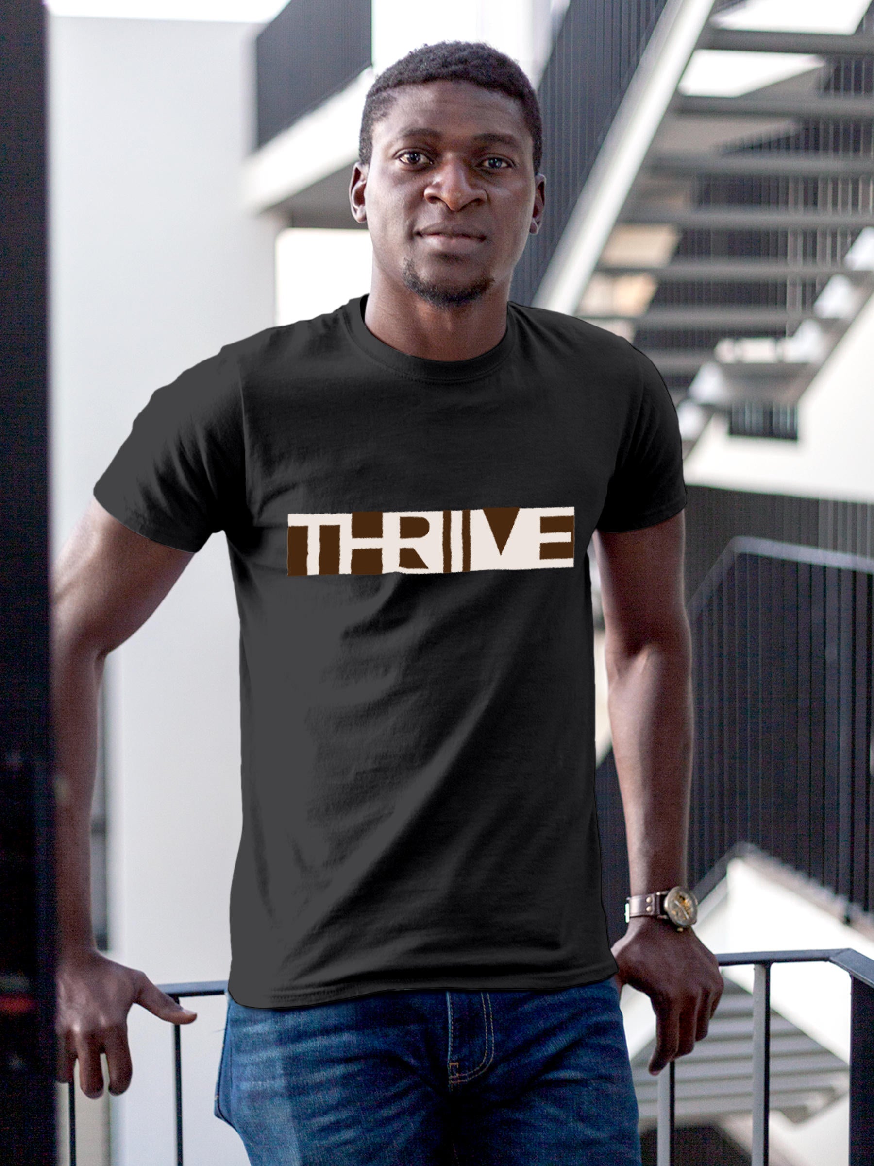 Model wearing Men's Dark Grey Round Neck T-shirt with 'Thrive' design, offering effortless style and premium comfort