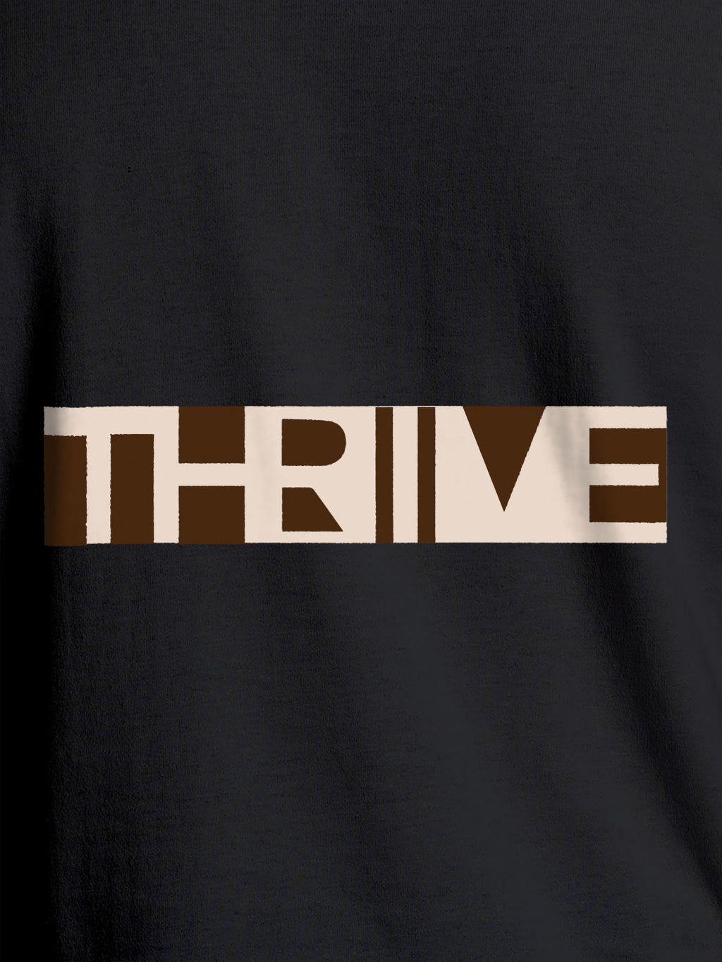 Close up of 'Thrive' design on Women's Dark Grey Round Neck T-shirt, highlighting intricate details and vibrant print.