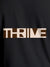 Close up of 'Thrive' design on Women's Dark Grey Round Neck T-shirt, highlighting intricate details and vibrant print.