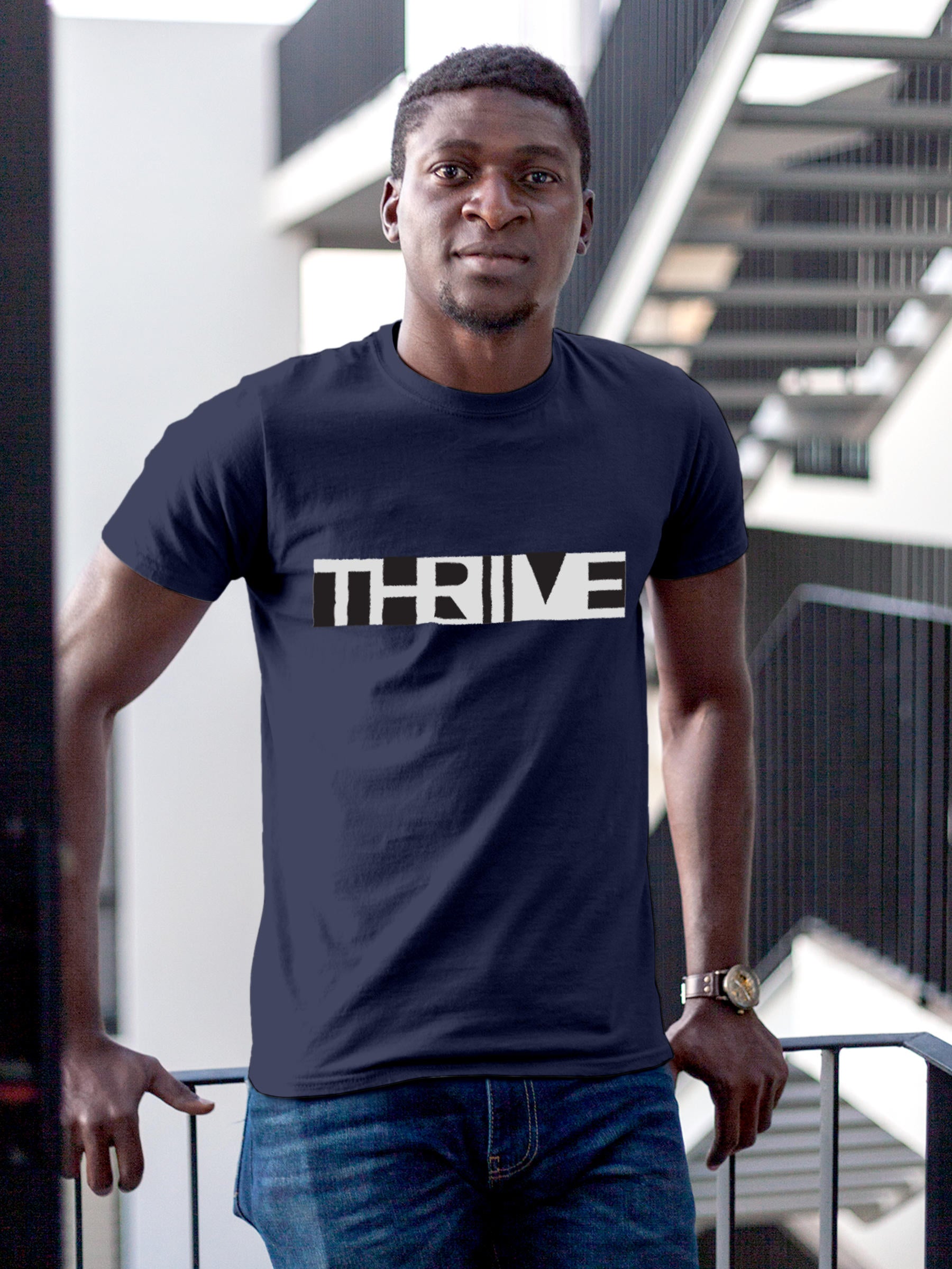 Model wearing Men's Navy Blue Round Neck T-shirt with 'Thrive' design, offering effortless style and premium comfort