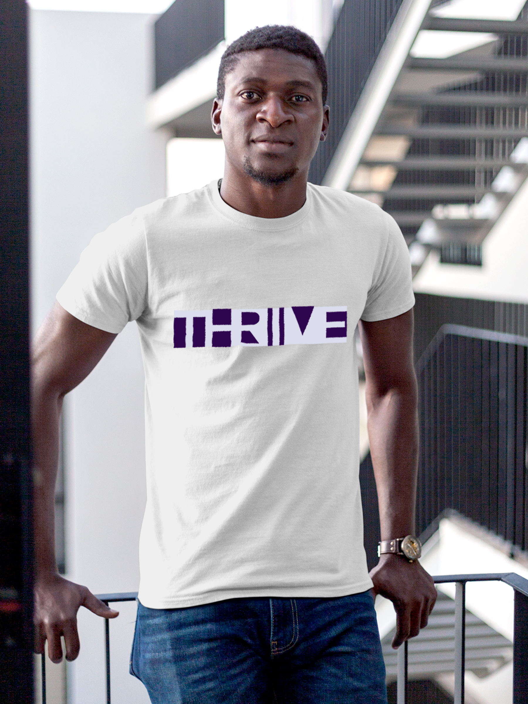 Model wearing Men's White Round Neck T-shirt with 'Thrive' design, offering effortless style and premium comfort