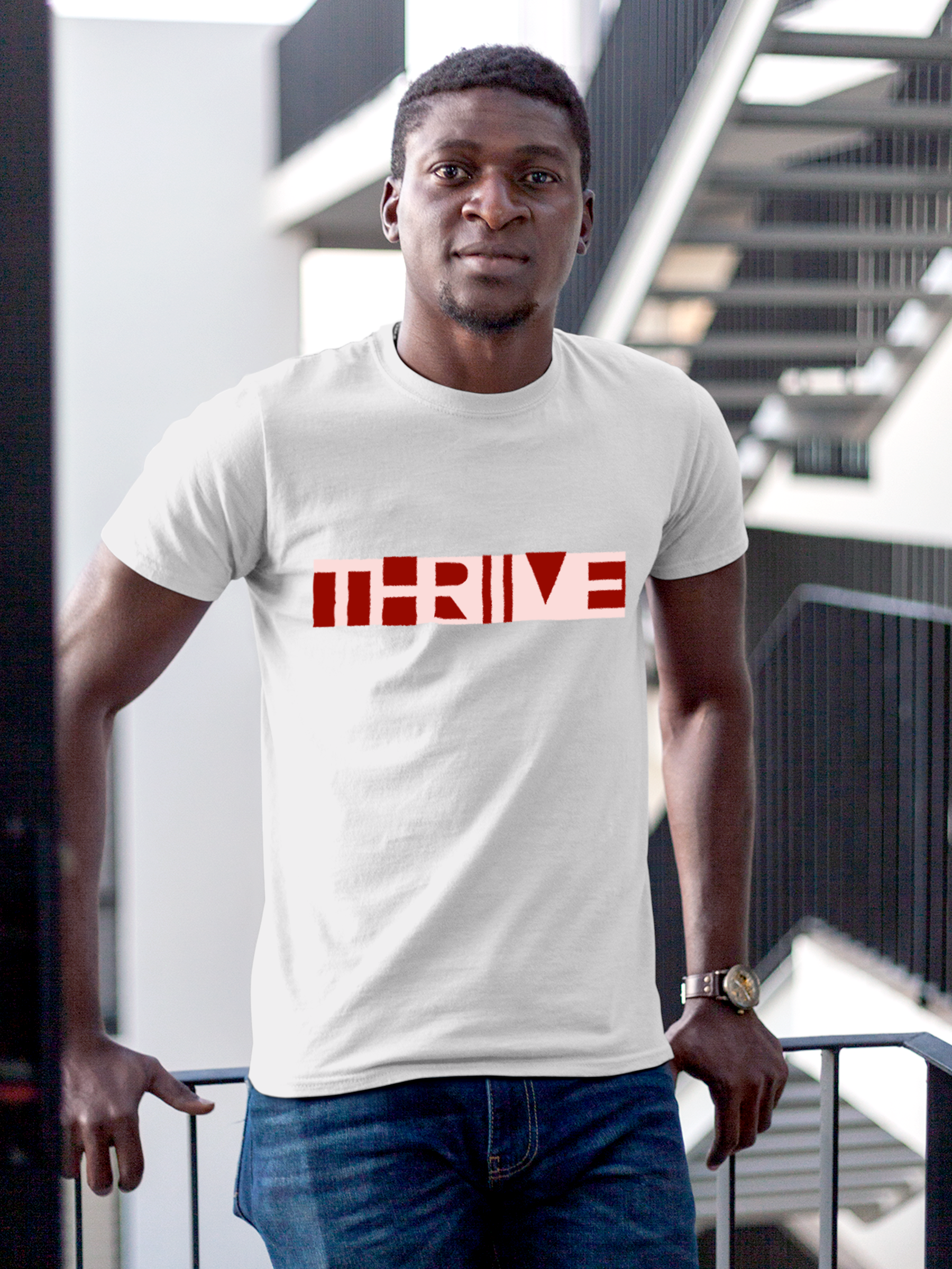 Model wearing Men's White Round Neck T-shirt with 'Thrive' design, offering effortless style and premium comfort