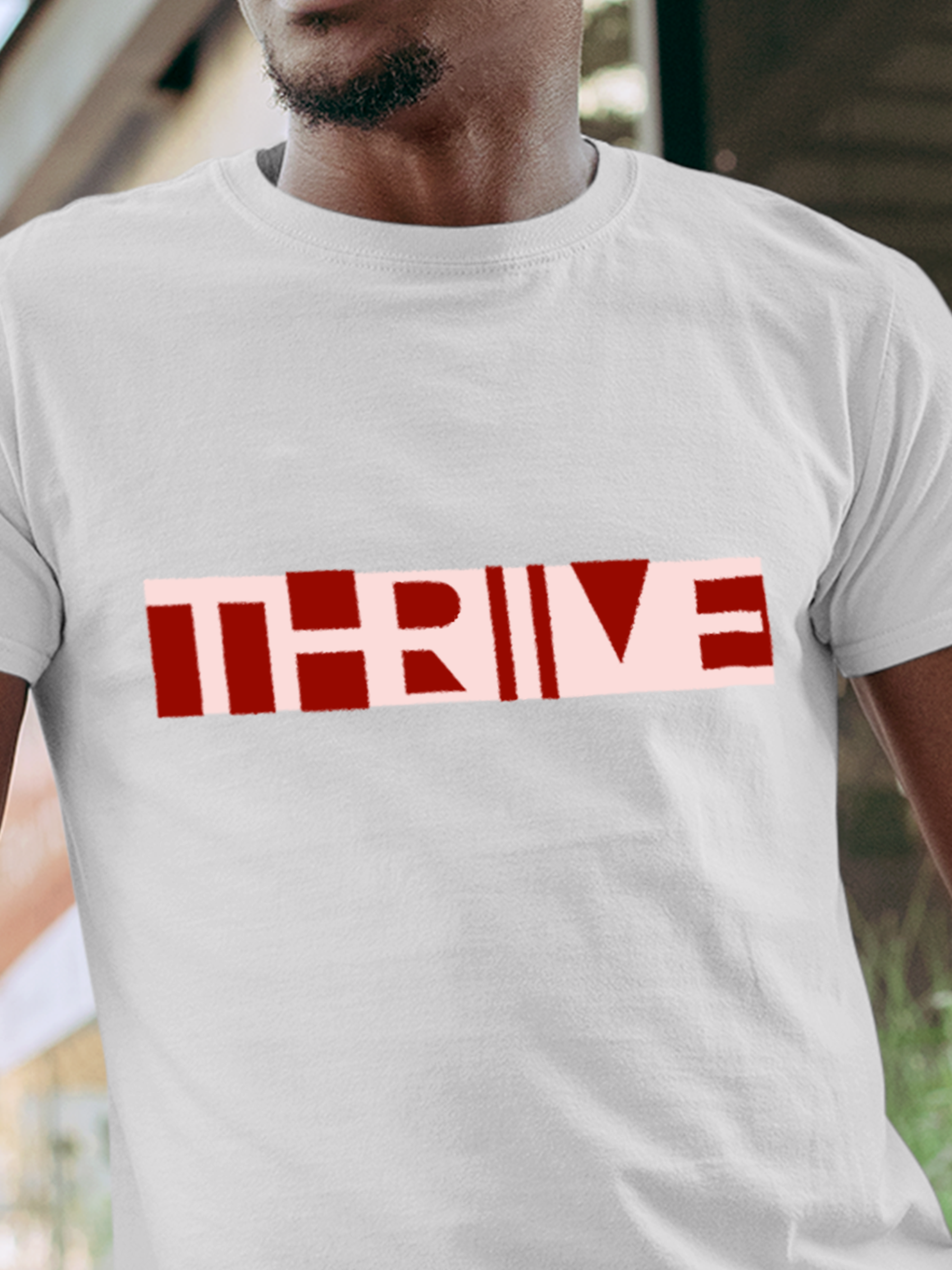 Close up of 'Thrive' design on Men's White Round Neck T-shirt, highlighting intricate details and vibrant print.