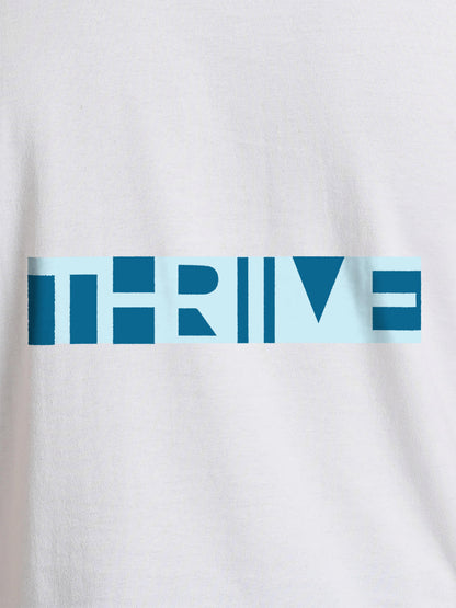 Close up of 'Thrive' design on Women's White Round Neck T-shirt, highlighting intricate details and vibrant print.