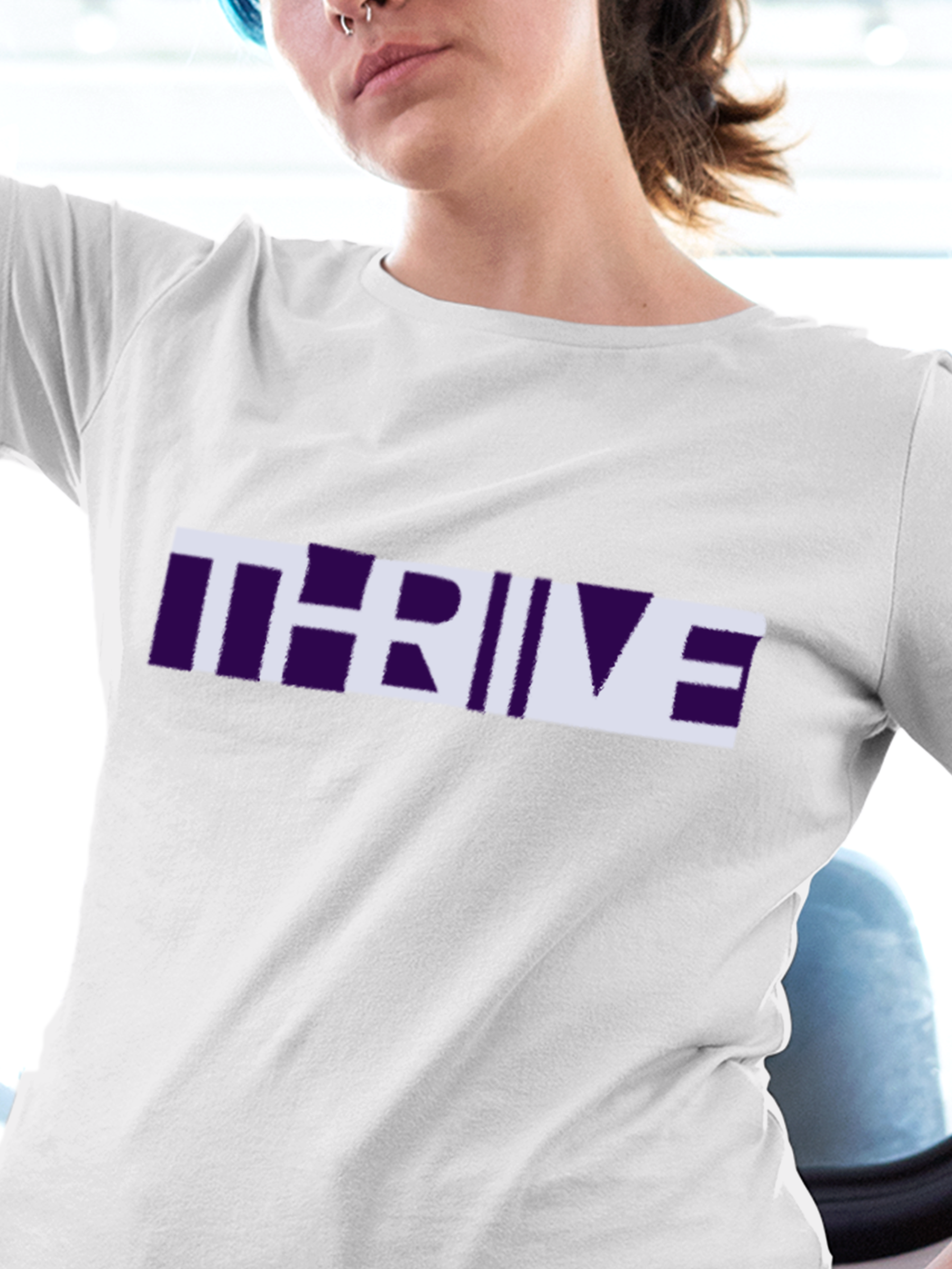 Close up of 'Thrive' design on Women's White Round Neck T-shirt, highlighting intricate details and vibrant print.