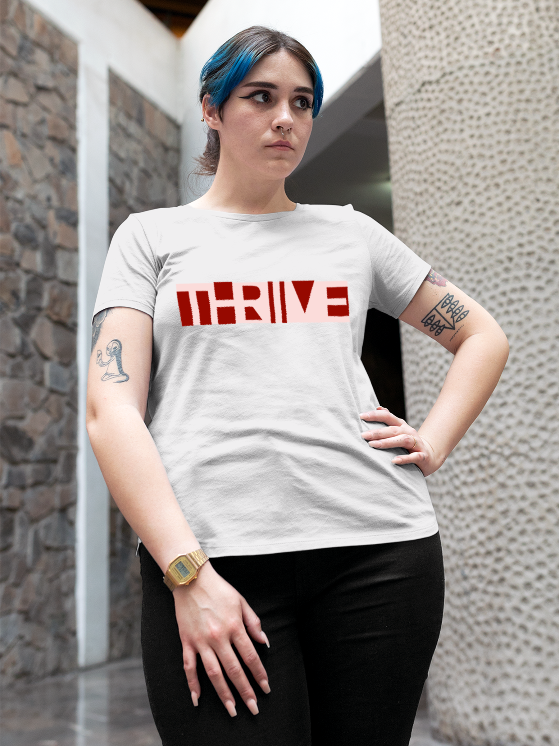 Model wearing Women's White Round Neck T-shirt with 'Thrive' design, offering effortless style and premium comfort