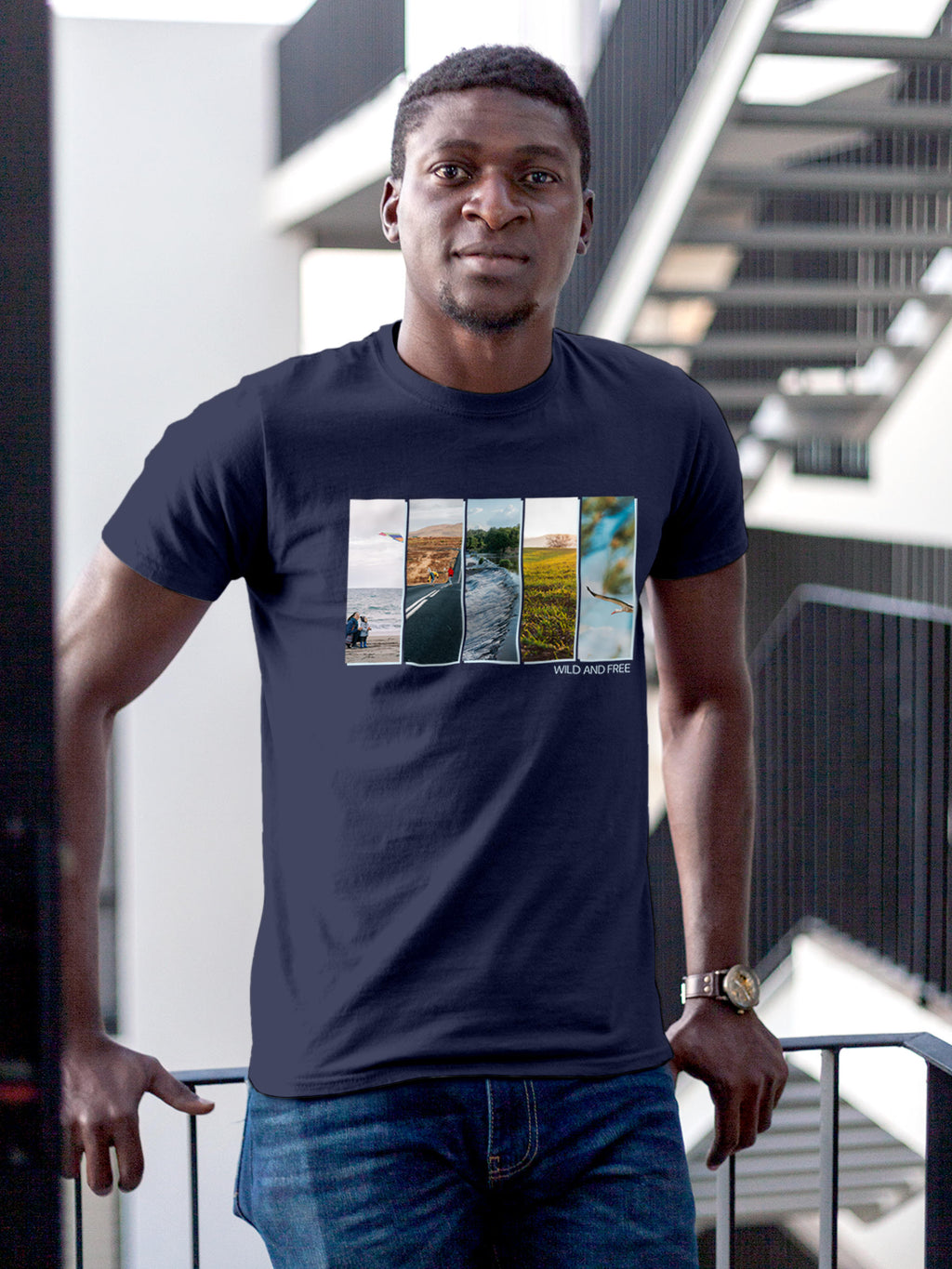 Model wearing Men's Navy Blue Round Neck T-shirt with 'Wild & Free' design, offering effortless style and premium comfort