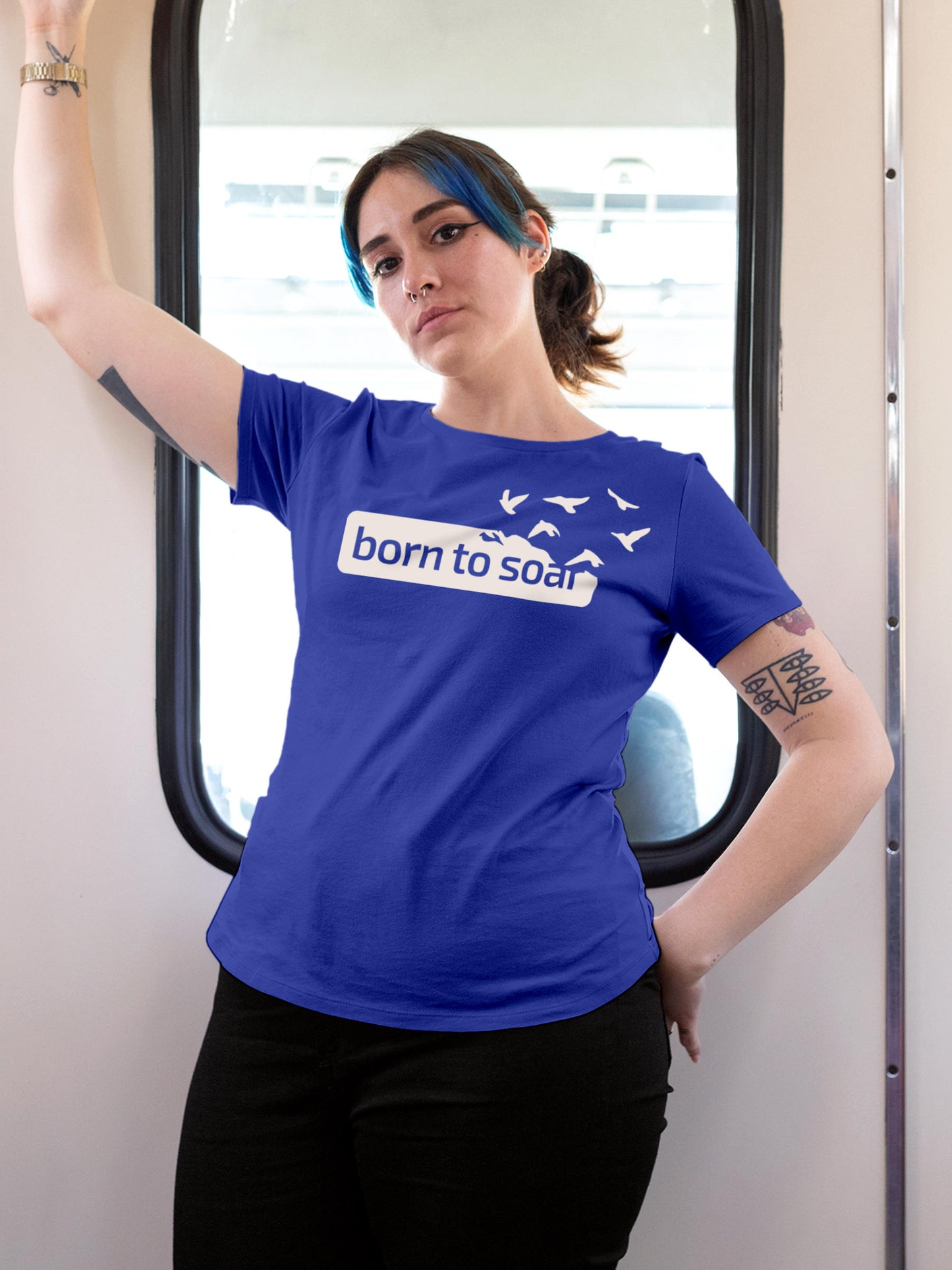 Model wearing Women's Blue Round Neck T-shirt with 'Born To Soar' design, offering effortless style and premium comfort