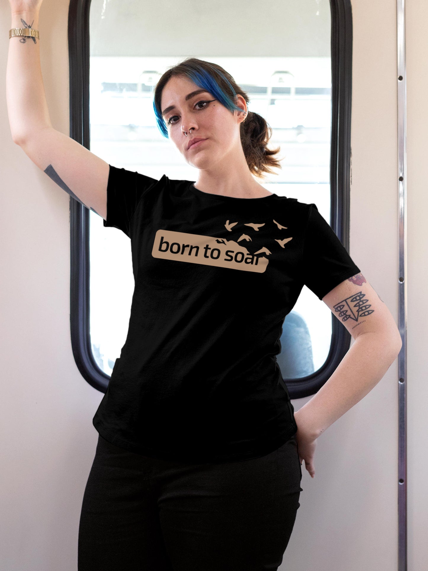 Model wearing Women's Black Round Neck T-shirt with 'Born To Soar' design, offering effortless style and premium comfort