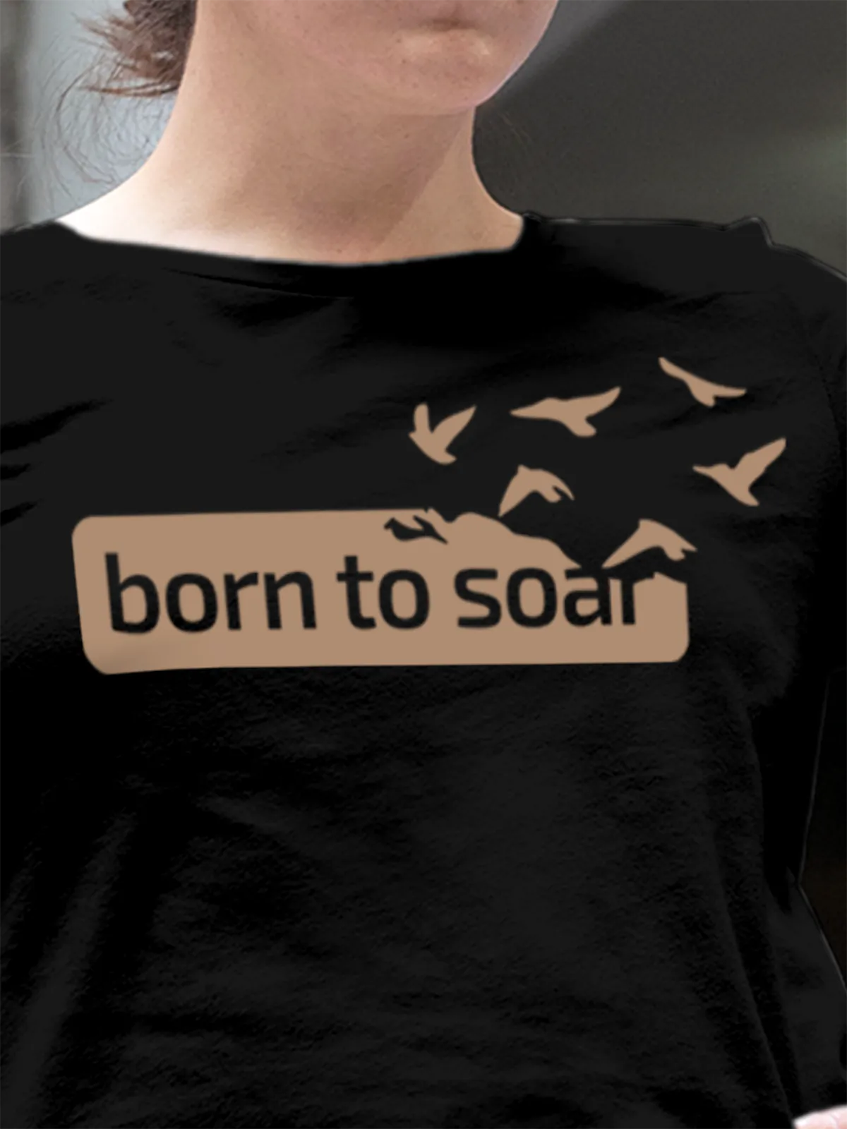 Close up of 'Born To Soar' design on Women's Black Round Neck T-shirt, highlighting intricate details and vibrant print.