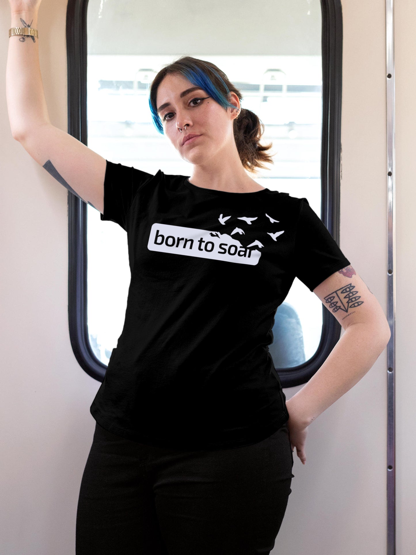 Model wearing Women's Black Round Neck T-shirt with 'Born To Soar' design, offering effortless style and premium comfort