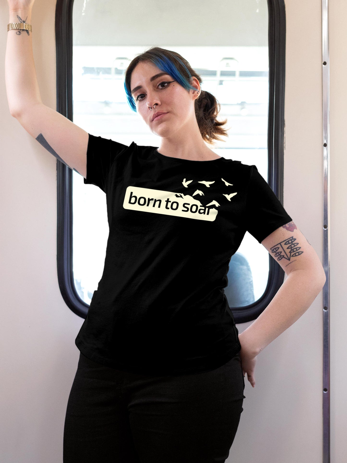 Model wearing Women's Black Round Neck T-shirt with 'Born To Soar' design, offering effortless style and premium comfort